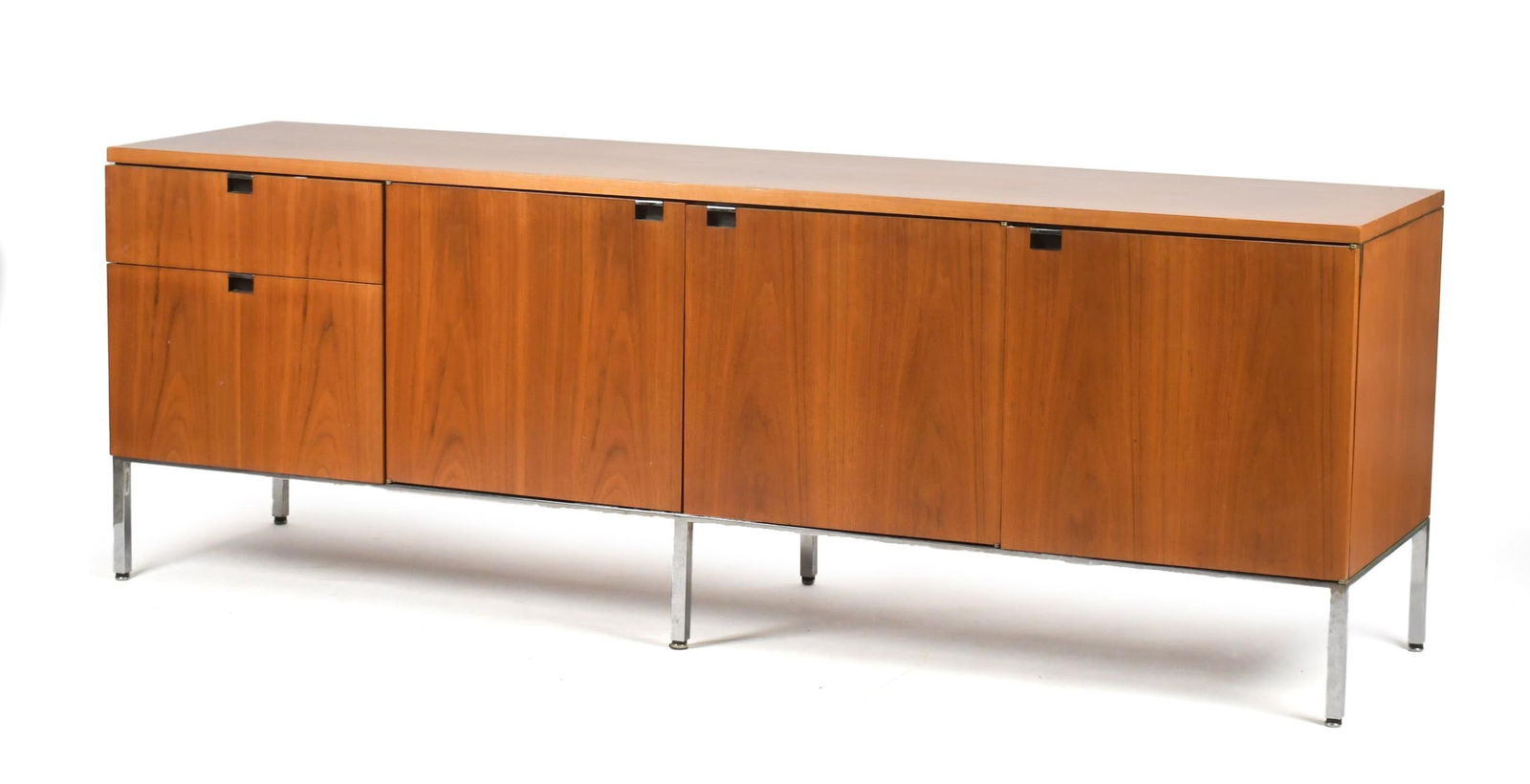 VINTAGE 20TH C. TEAK GEORGE NELSON CREDENZA.: A vintage mid 20th C. teak credenza with chrome legs. Unlabeled, attributed to George Nelson for Herman Miller. 27.25”H x 78.5”W x 20”D.
