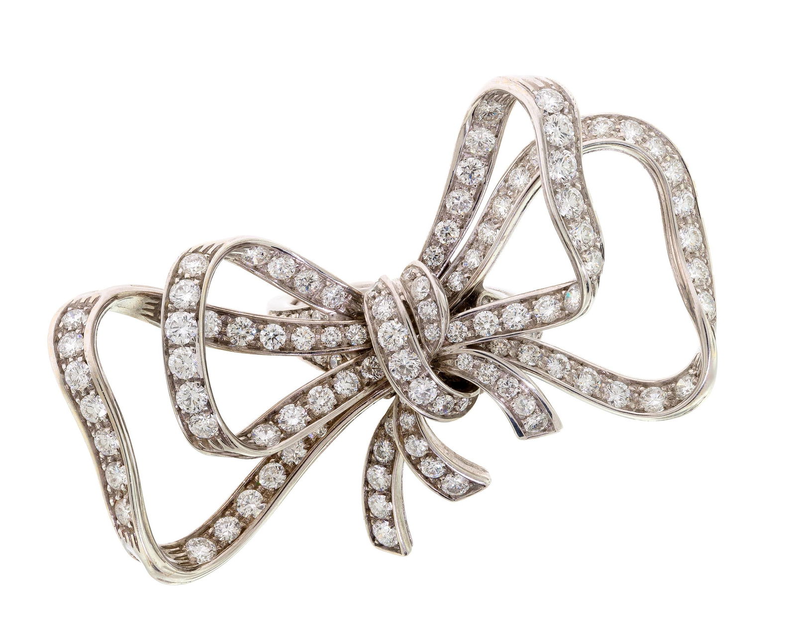 18K WHITE GOLD DIAMOND BOW STATEMENT RING.: An 18k white gold (stamped) bow statement ring set with approx. 3.45 ct. tw. round brilliant cut, natural diamonds of G-H color and VS clarity. Ring size 5 3/4 (has tension ring sizer), 2 inches wide