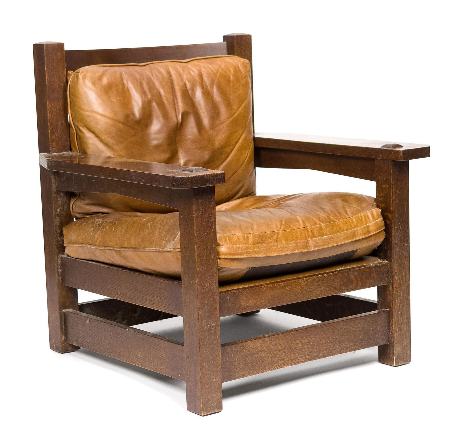 20TH C. STICKLEY MISSION OAK ARMCHAIR.: A 20th C. L. & J.G. Stickley (Manlius, NY) labeled ‘Eastwood’ Mission Oak/Arts & Crafts large scale armchair with brown leather loose seat and back cushions.36.5”H x 36”W x