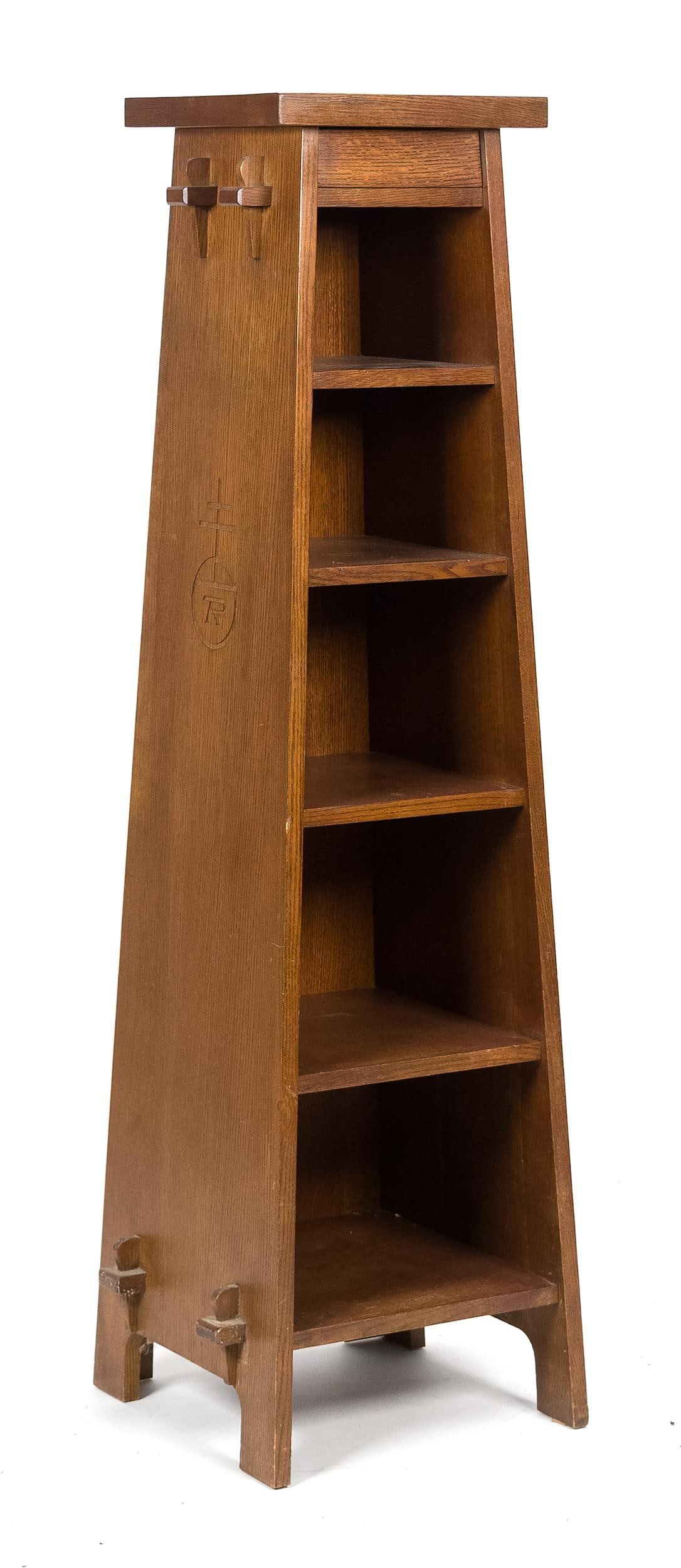 20TH C. STICKLEY/ROYCROFT MAGAZINE PEDESTAL.: A Stickley (Manlius, NY) number 89-80 ca. 2006 Roycroft reproduction canted magazine pedestal/bookcase, with a concealed upper drawer and keyed through-tenon construction. Retains Stickley label and
