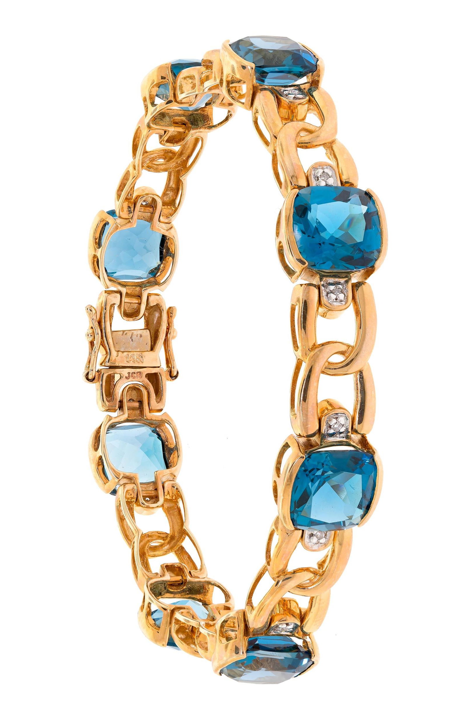 14K GOLD DARK BLUE TOPAZ & DIAMOND BRACELET.: A 14k yellow gold (stamped) bracelet set with approx. 16 ct. tw., faceted cushion cut, very dark blue topaz and approx. .08 ct. tw. single cut round, natural diamonds of H color and SI clarity, 9mm