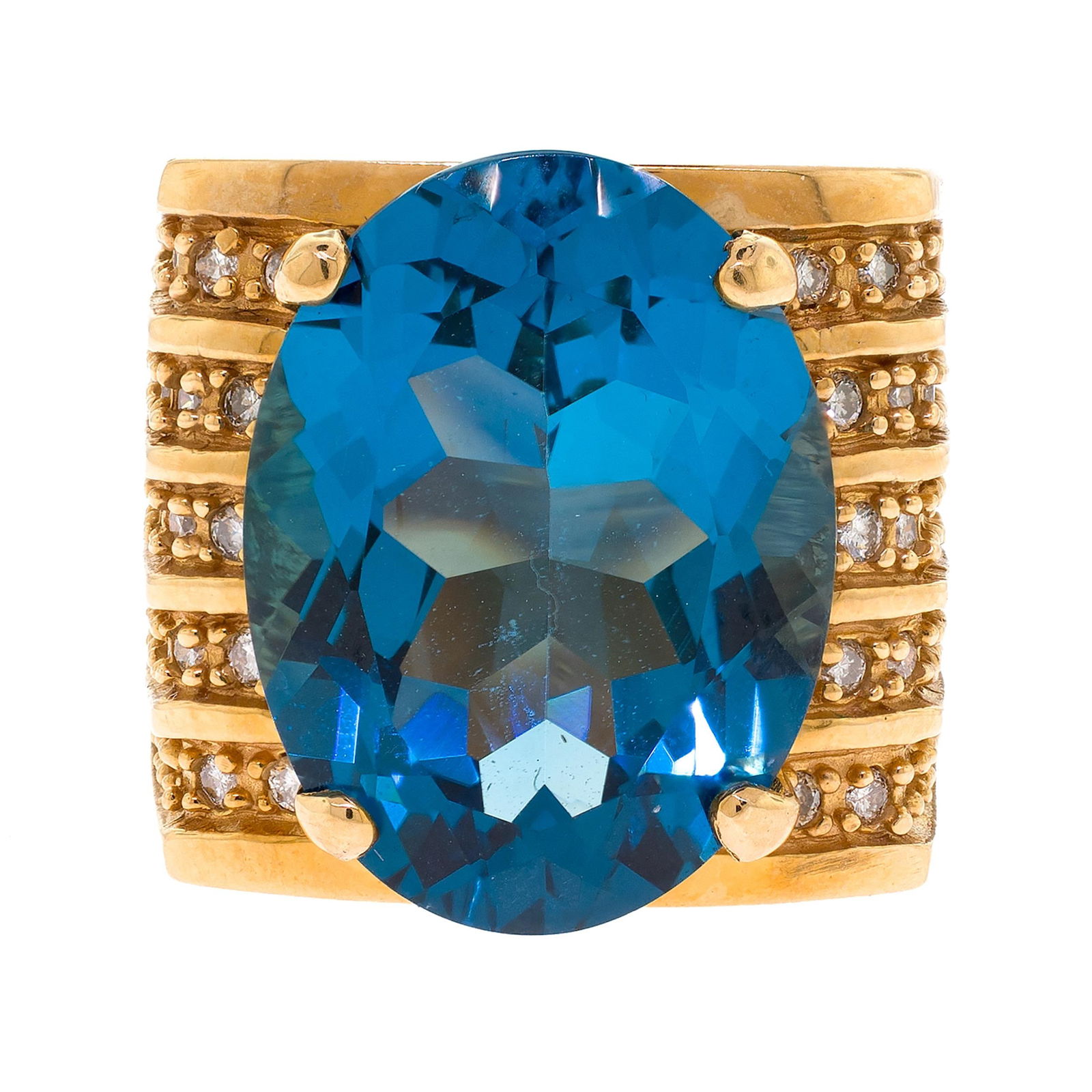 14K GOLD DARK BLUE TOPAZ & DIAMOND RING.: A 14k yellow gold (stamped) ring set with an approx. 20 ct., faceted oval, very dark blue topaz and approx. .50 ct. tw. round brilliant cut, natural diamonds of H-I color and VS-SI clarity. Ring size