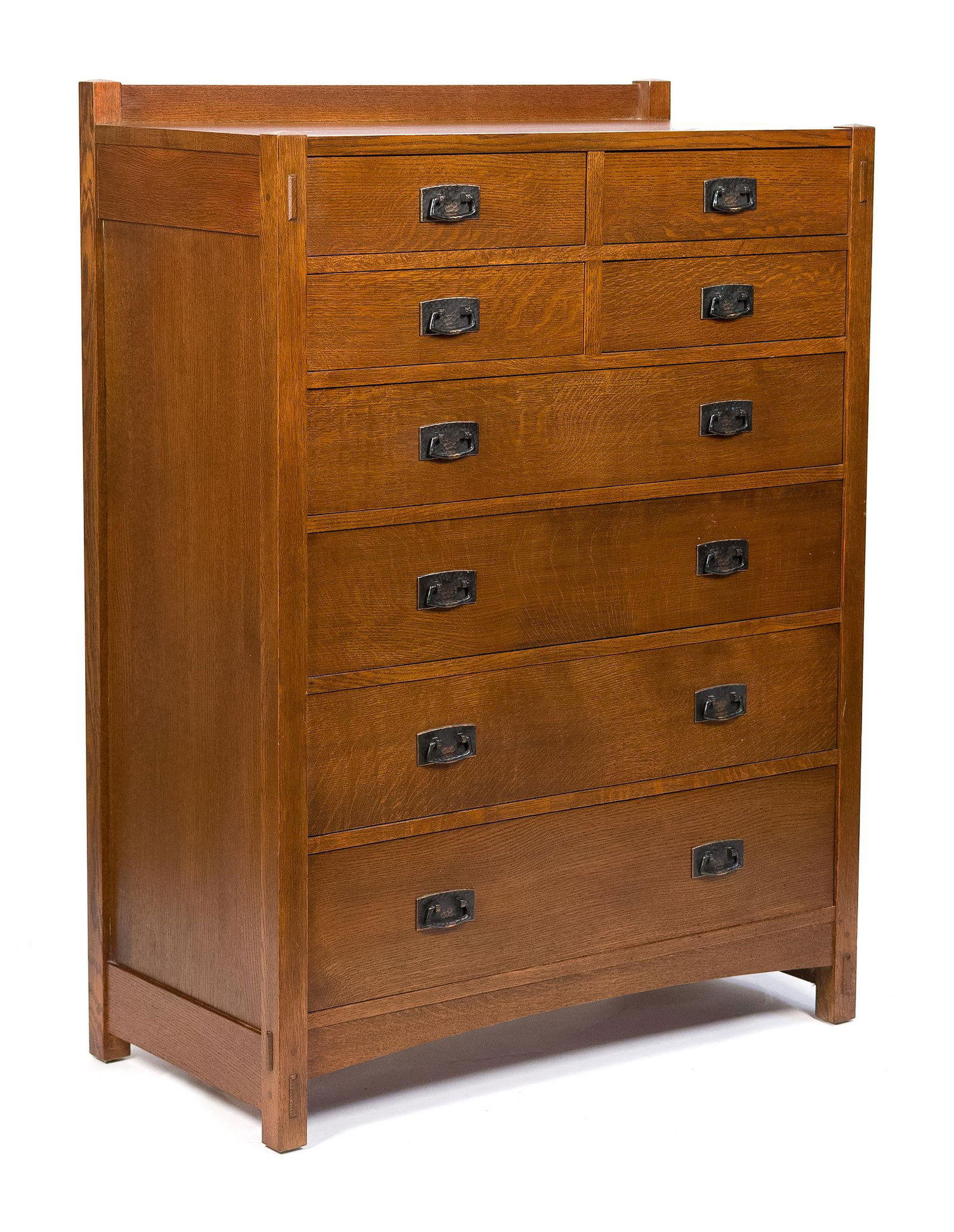 20TH C. STICKLEY MISSION OAK EIGHT DRAWER DRESSER.: A vintage 20th C. Arts & Crafts Stickley (Manlius, New York) branded and labeled eight drawer tall chest, with original hand hammered hardware and through-tenon construction.55”H x 40”W x