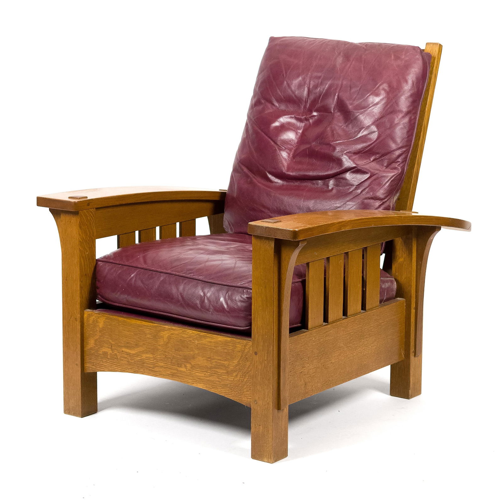 VINTAGE STICKLEY ARTS & CRAFTS OAK MORRIS CHAIR.: A vintage 20th C. L&JG Stickley (Manlius, NY) labeled Mission oak ‘Morris’ chair with loose leather cushions. 38”H x 34.5”W x 40.5”D x 18” seat H.