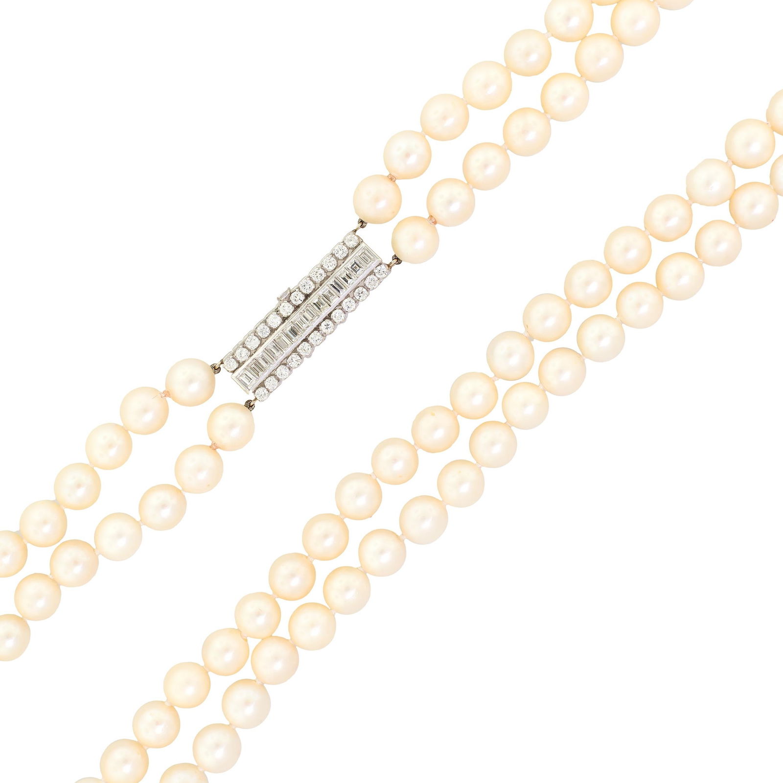 18K GOLD DIAMOND DOUBLE STRAND PEARL NECKLACE.: A vintage Akoya cultured pearl necklace, double strand necklace, with light to dark cream, 9mm round, lightly blemished pearls with good to very good luster, with an 18k white gold (tested) clasp set