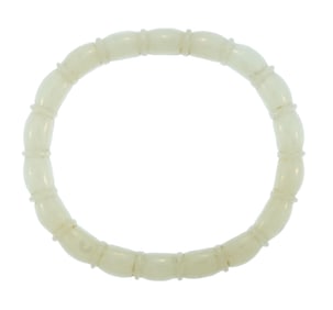 CARVED CHINESE MUTTON FAT WHITE JADE BANGLE.