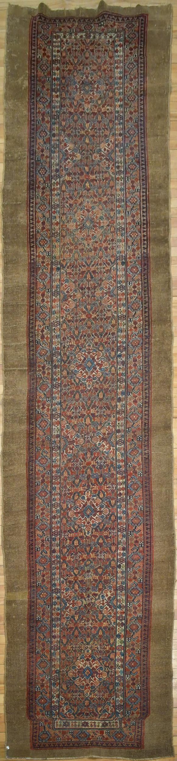 ANTIQUE ORIENTAL SERAB RUNNER RUG.: An antique hand woven Oriental Serab runner, highlighted in blue, red and ivory. 3’4” x 14’5”.
