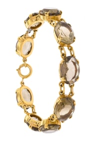 ENGLISH 9CT GOLD SMOKY QUARTZ BRACELET.