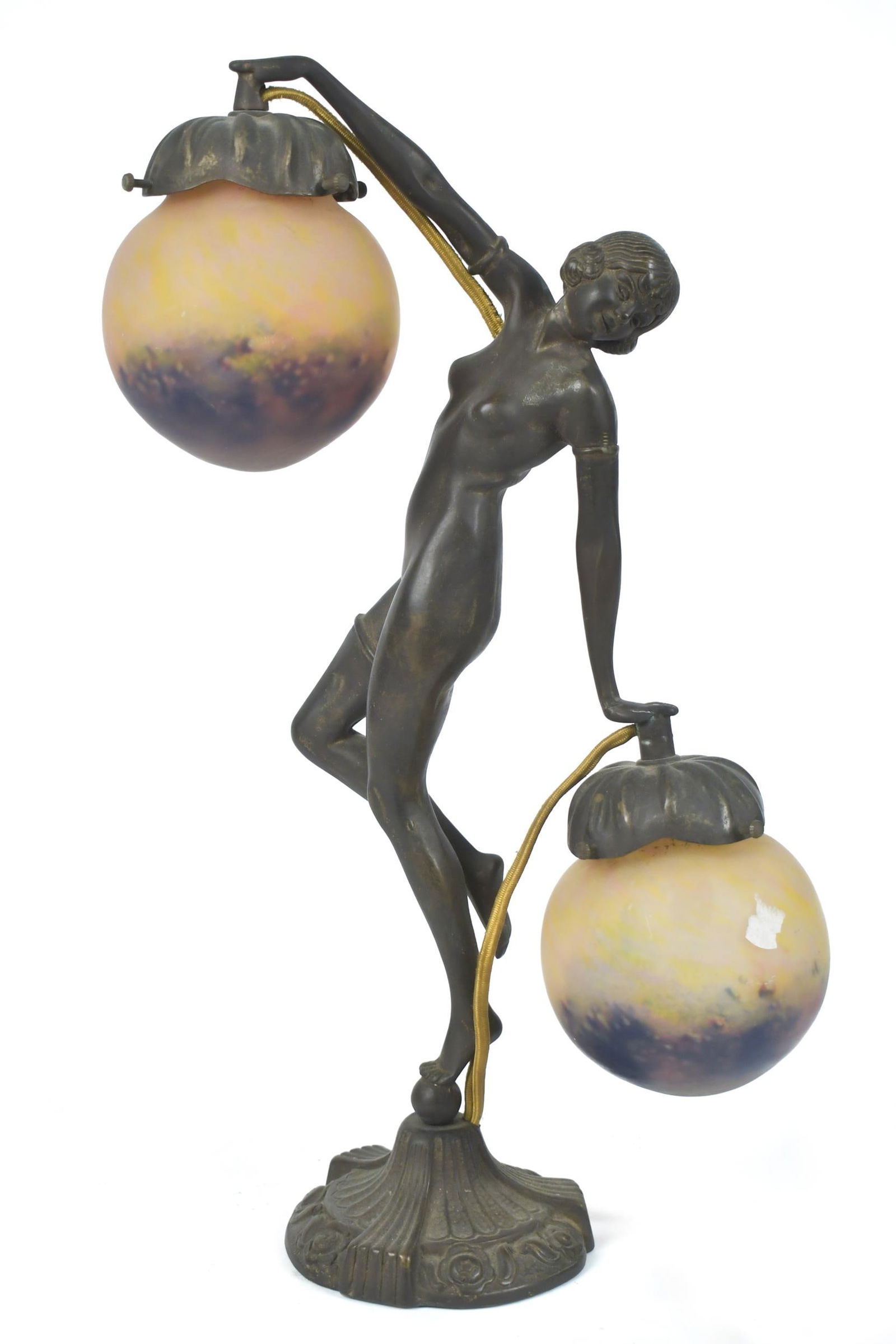 ART NOUVEAU TABLE LAMP, DANCING WOMAN.: An Art Nouveau bronze table lamp, dancing woman, with two yellow/purple art glass shades, stamped on bottom, GB, 17”H x 10”W. Provenance: Ilse Bischoff/Timotheus Pohl Estate.