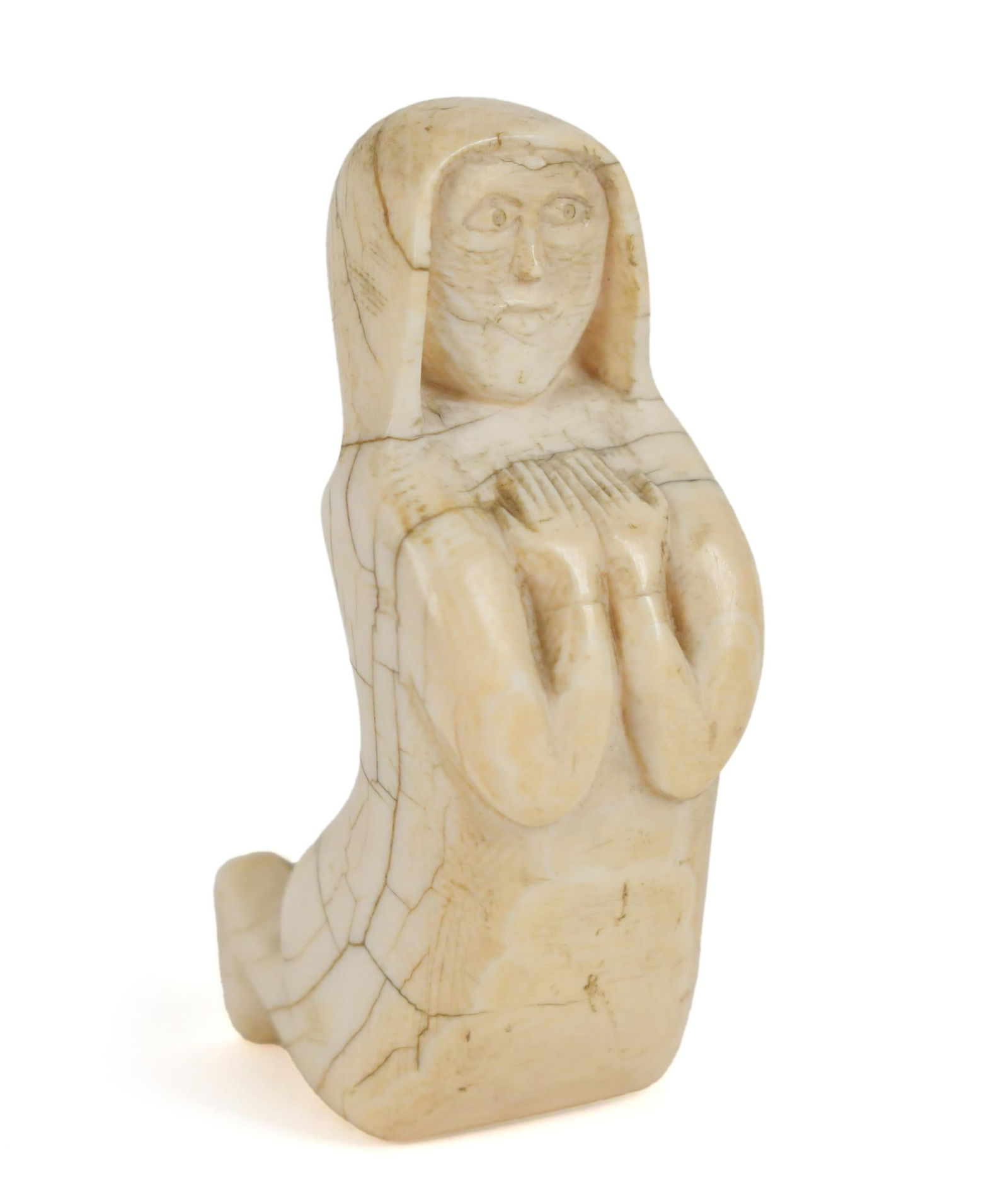 EARLY CARVED PERSIAN BONE FIGURE, PRAYING WOMAN.: A late 17th/early 18th C. carved bone figure of a woman praying. 3.75”H.