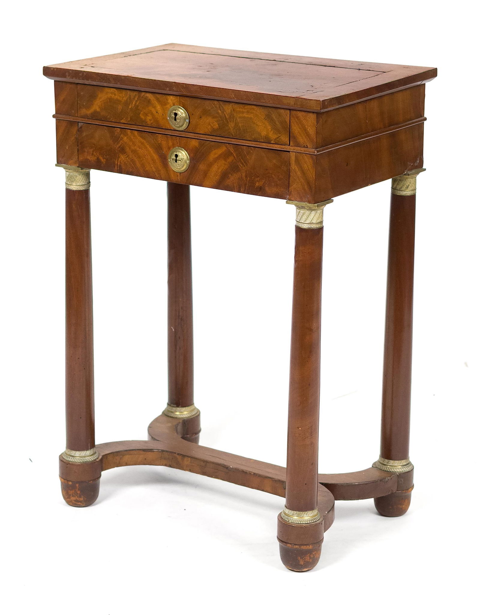 19TH C. FRENCH EMPIRE MAHOGANY STAND.: A 19th C. figured mahogany veneer stand, two drawers with urn escutcheons, on columnar legs with ormlou mounts and an X-form stretcher. 28.5”H x 20”W x 13.5”. Provenance: Ilse