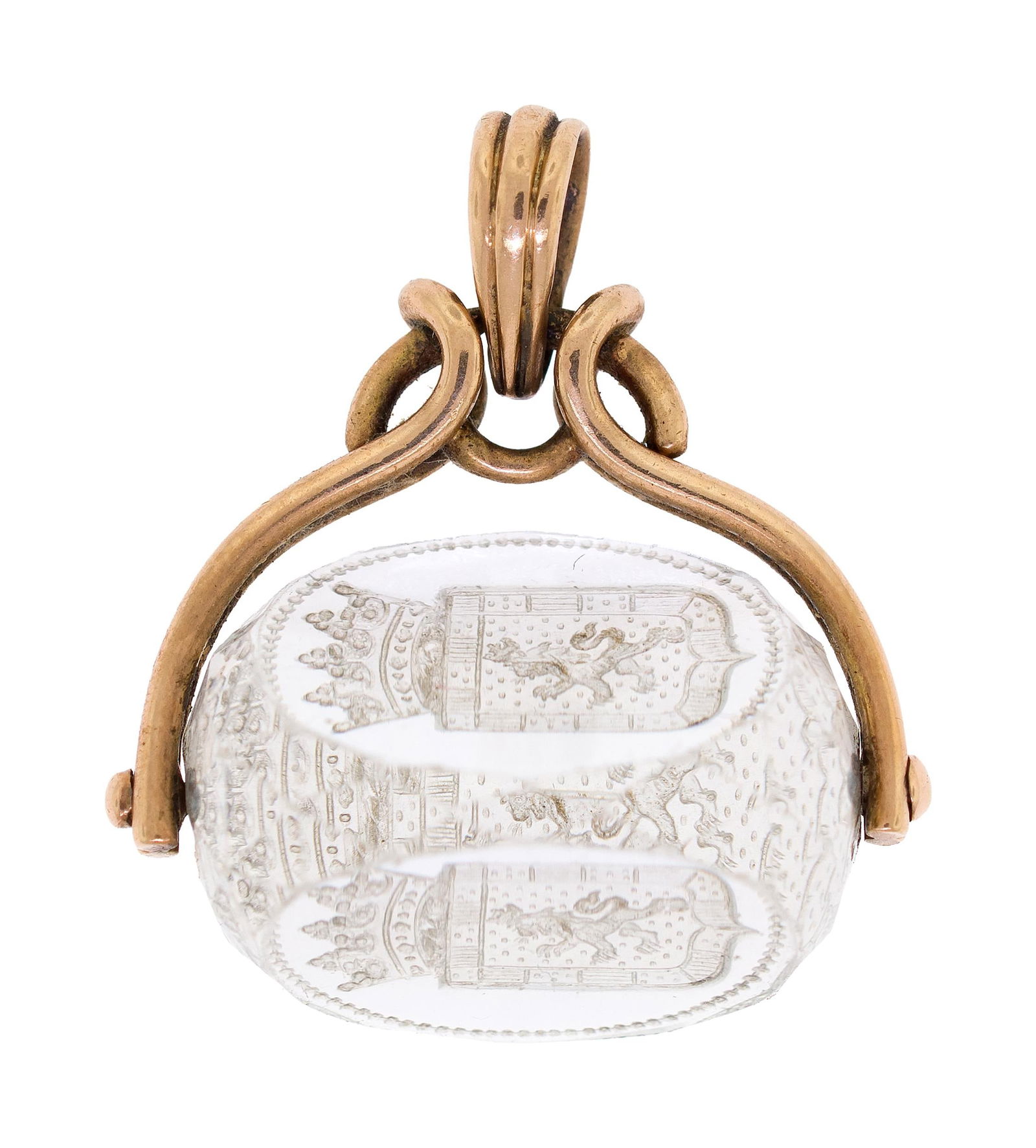 ANTIQUE 14K GOLD FAMILY CREST WATCH FOB.: An antique, 14k yellow gold (tested) watch fob with a carved rock crystal family crest, 1 inch long, 10 grams.