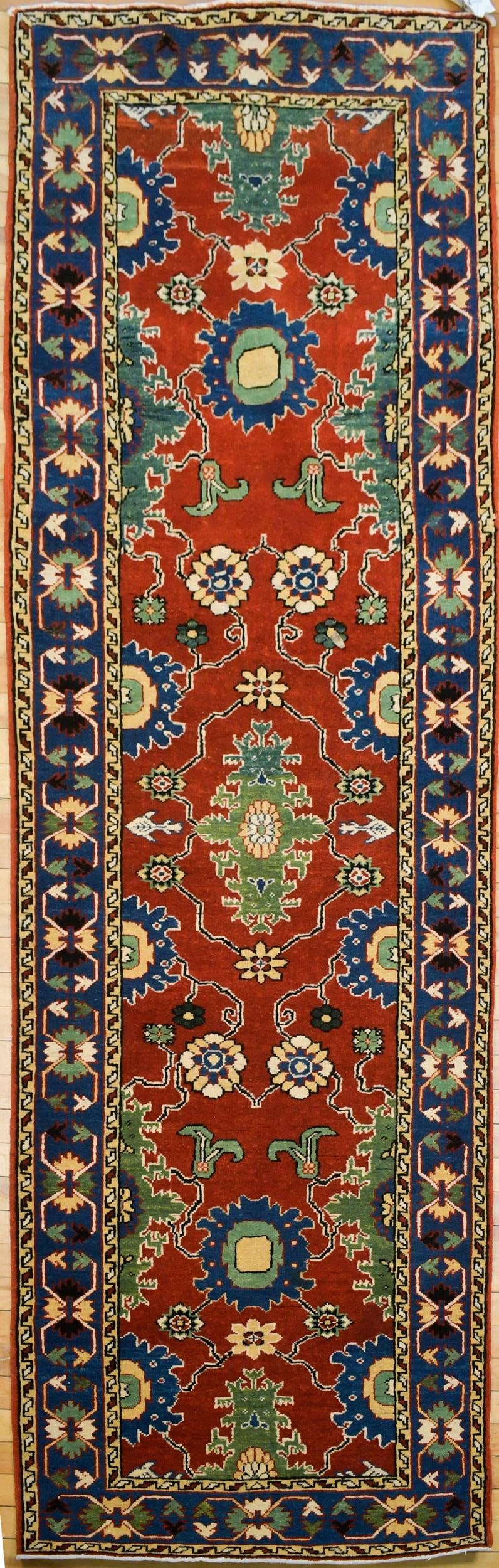 VINTAGE ORIENTAL RUNNER RUG.: A vintage Oriental Turkish runner, with vibrant red, blue and green highlights. 2’10” x 8’6”.
