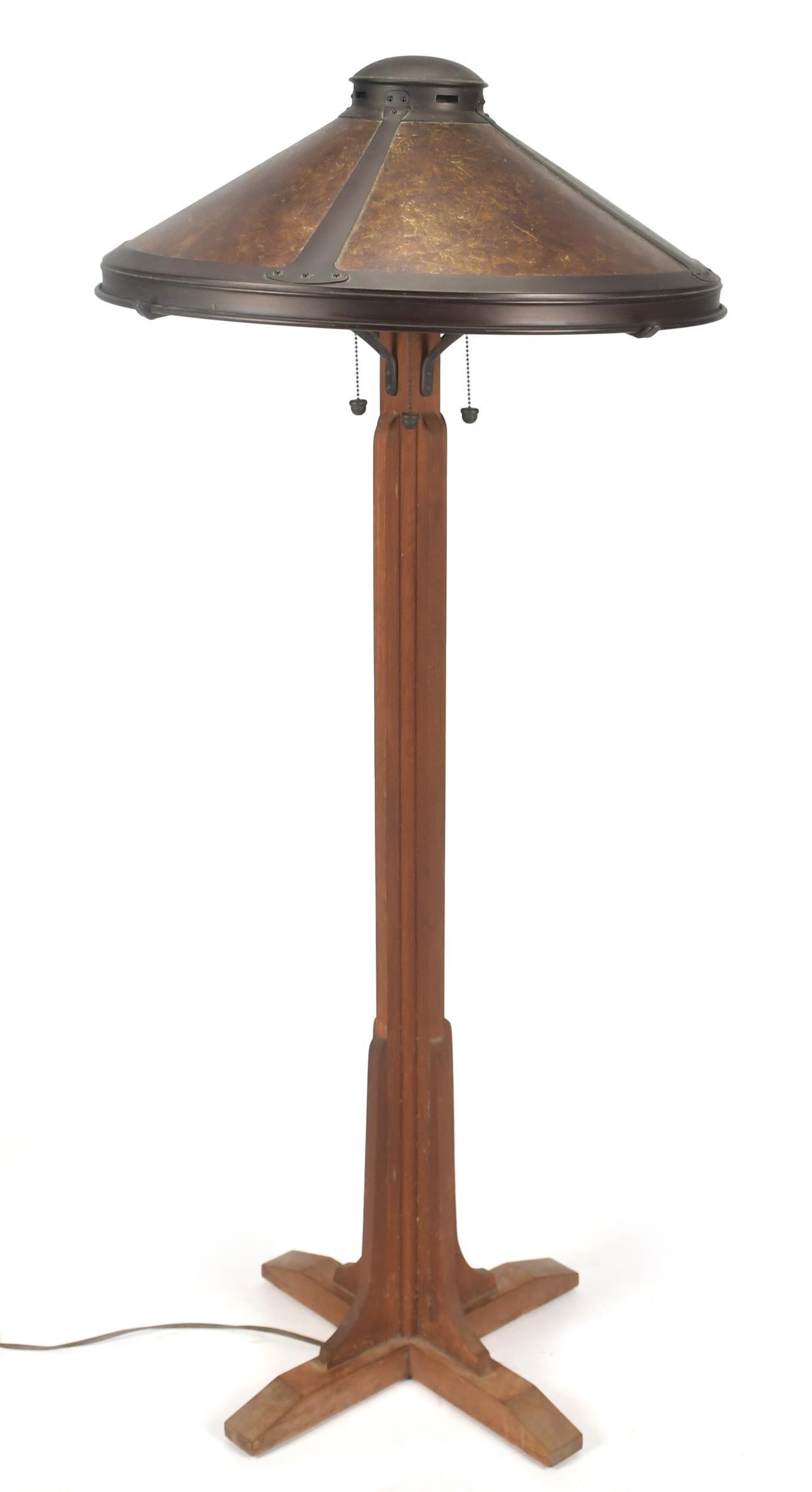 MICA LAMP CO ARTS & CRAFTS FLOOR LAMP.: A 20th C. Mica Lamp Co. Arts & Crafts/ Mission oak floor lamp with a paneled mica shade and oak base/column,60”H x 24” dia shade.