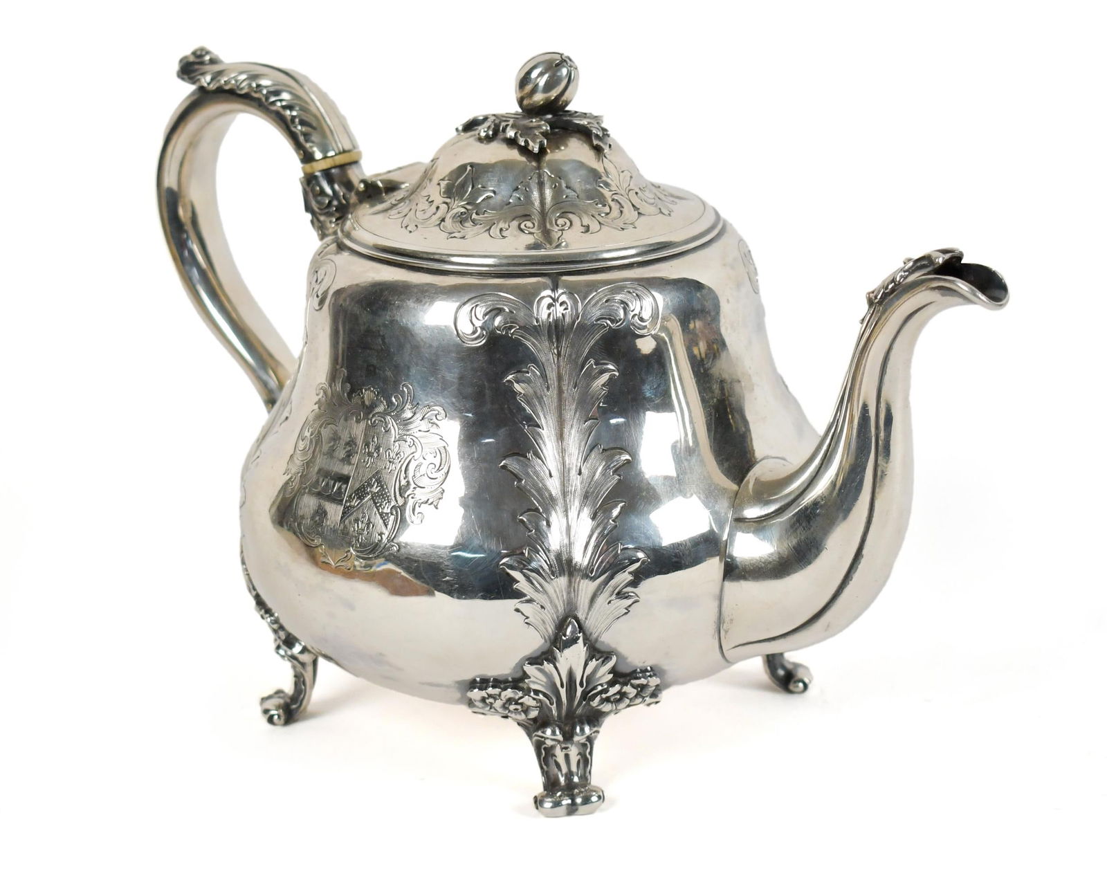19TH C. ENGLISH STERLING TEA POT, ROBERT HENNELL.: A late 19th C. Robert Hennell squat form tea pot with acanthus and chased decorations, hallmarked on underside and adorned with a coat of arms. 7.25”H, 31 oz t.