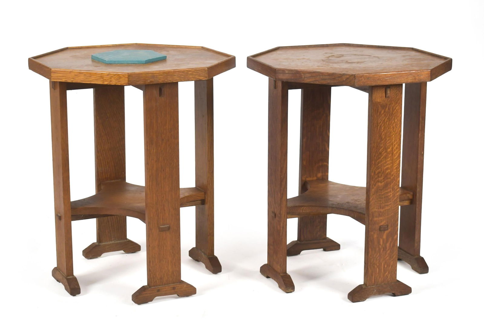 PR. 20TH C. STICKLEY ARTS & CRAFTS OAK LAMP TABLES.: A pair of 20th C. Stickley (Manlius NY) labeled octagonal top lamp tables with through-tenon construction and shoe feet. 24”H x 20” dia.