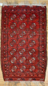 VINTAGE ORIENTAL BOKARA AREA RUG.