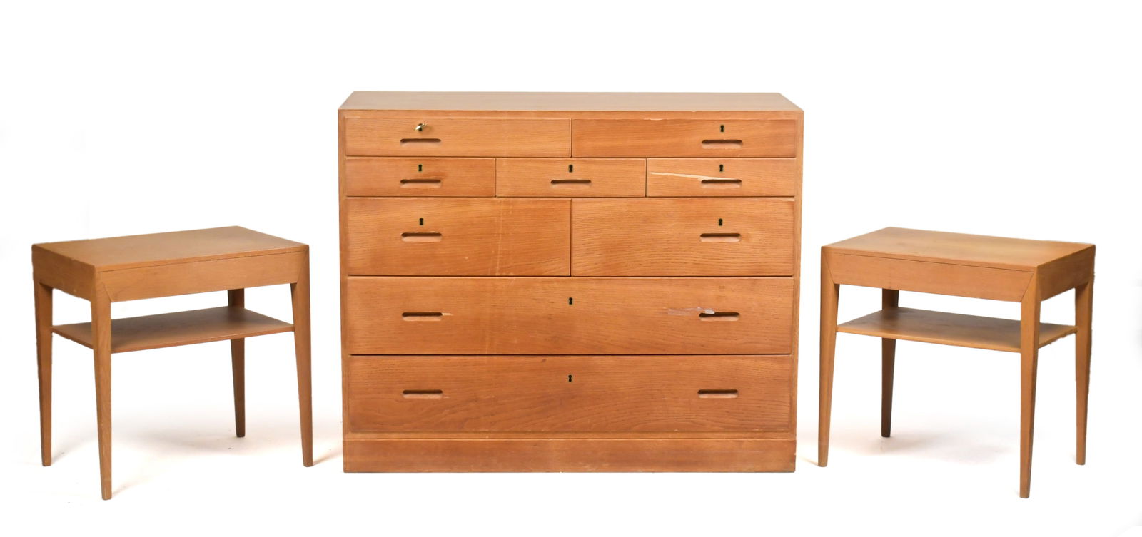 VINTAGE DANISH OAK FURNISHINGS, 3PCS.: Three pieces of vintage Danish oak furniture, including a multi-drawer chest and a matching pair of one drawer stands. Stands 19.5”H x 13.75”W x 19.75”D.Chest 31.75”H x