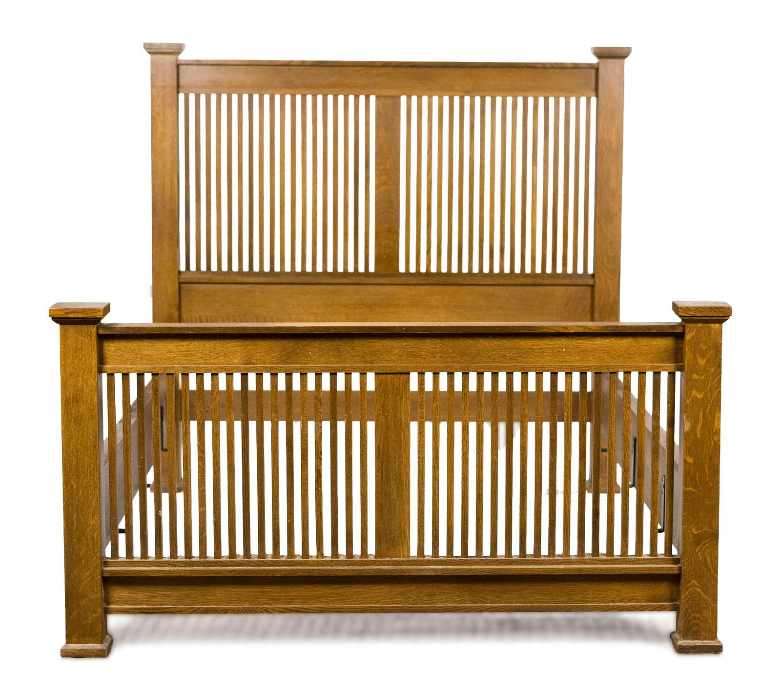 20TH C. STICKLEY ARTS & CRAFTS QUEEN BED FRAME.: A 20th C. Stickley (Manlius, NY) labeled Mission oak queen size bed frame. Overall 68.5”W x 91”L, Head board 64.25”H x Footboard 36”H.