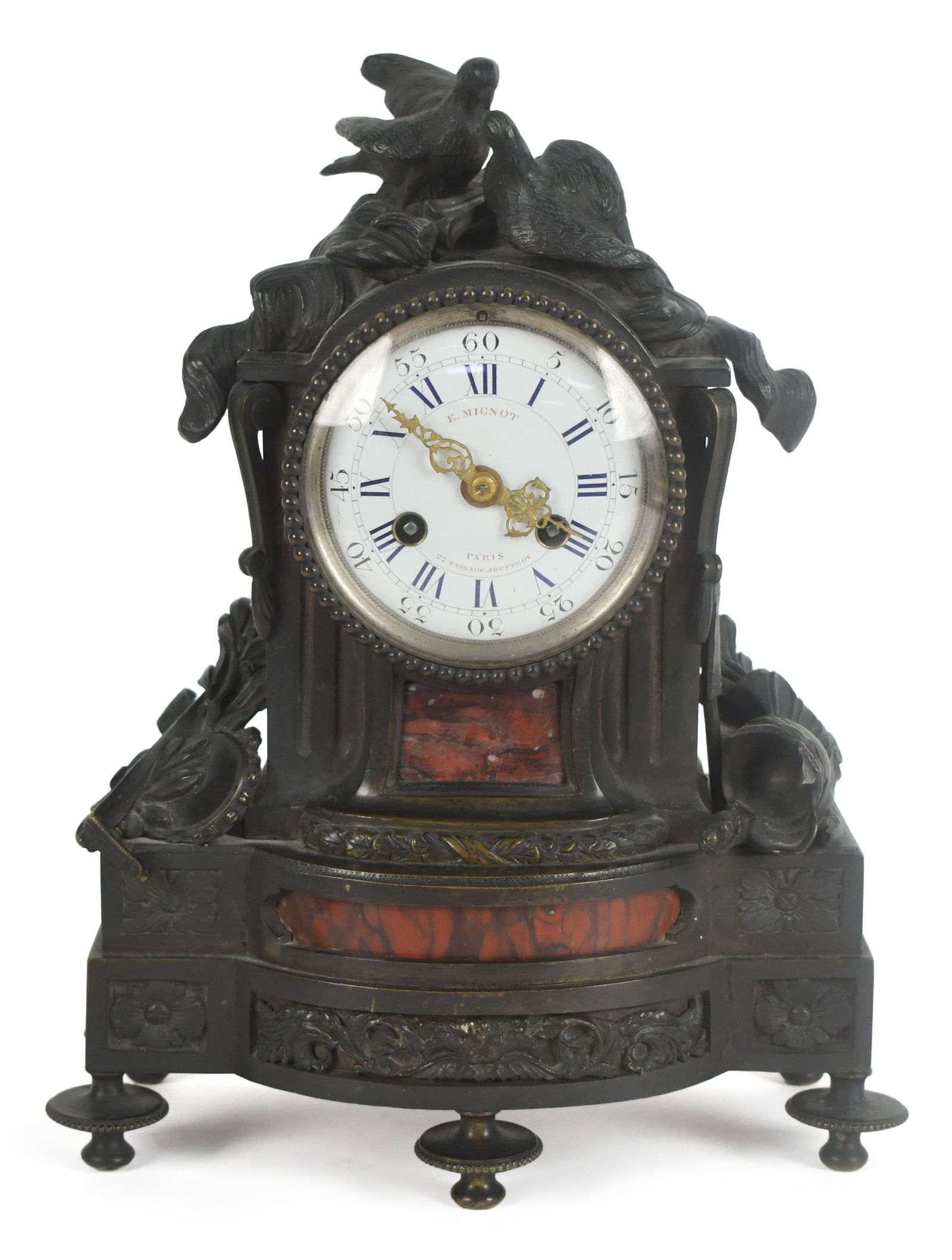 19TH C. E. MIGNOT FRENCH BRONZE MANTLE CLOCK.: A 19th C. French bronze and rouge marble mantle clock with E. Mignot Paris signed porcelain dial, 11”H x 8”W x 4”D.