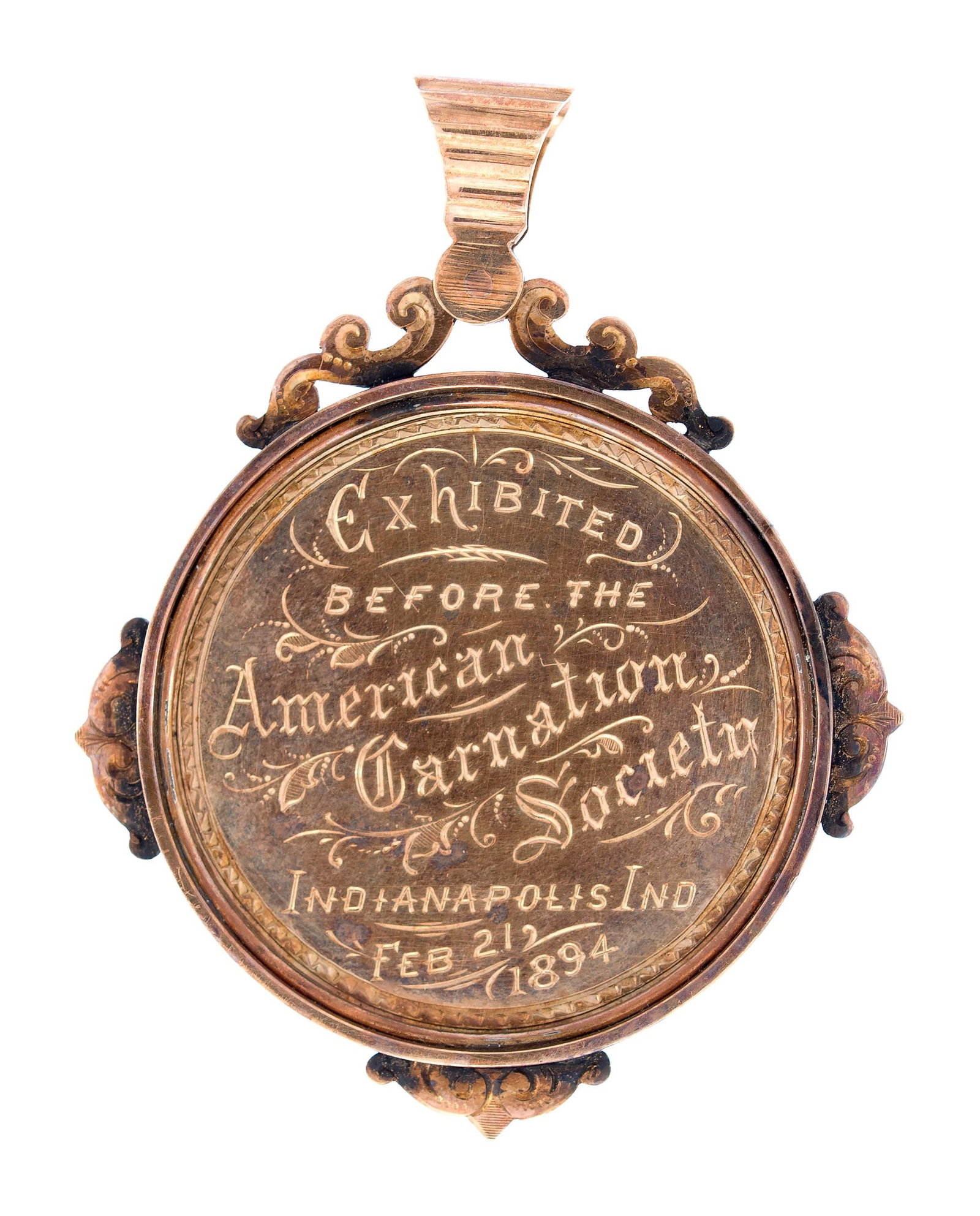 10K-14K GOLD AMERICAN CARNATION SOCIETY PENDANT.: An antique, 10k-14k rose gold medallion pendant given as an award presented to Fred Dorner, February, 21, 1894, by The American Carnation Society for the ”Best New Carnation”, 2.25 inches
