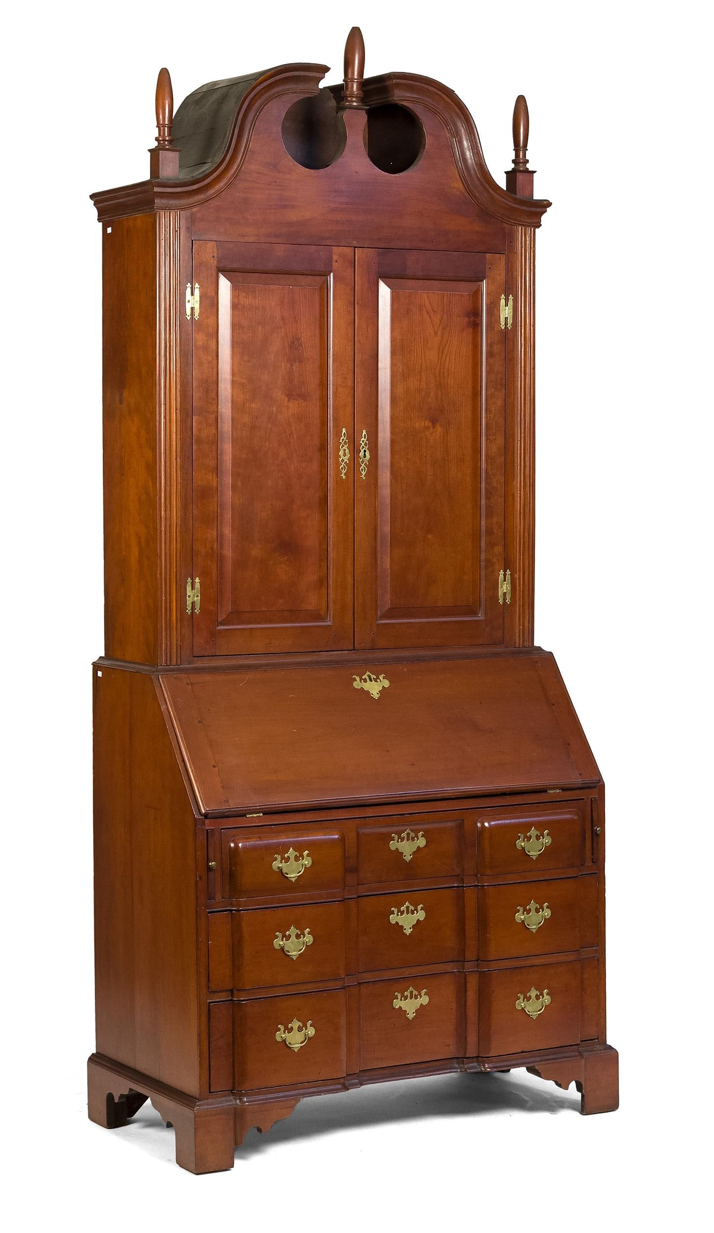 18TH C. CT RIVER VALLEY CHERRY SECRETARY.: A ca. 1765 Connecticut River Valley, likely Springfield Massachusetts area, block front two-part secretary. The upper bookcase section with three turned finials on a broken arch bonnet, over two