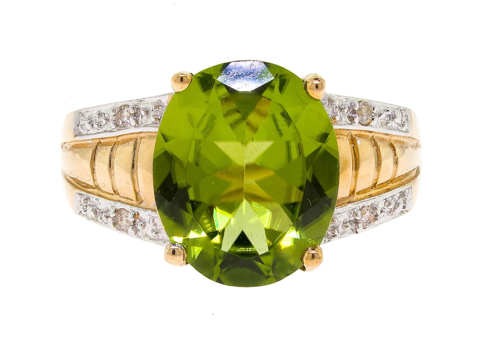 14K GOLD OVAL PERIDOT & DIAMOND RING.: A 14k yellow gold (stamped) ring set with an approx. 3.5 ct., faceted oval, medium dark yellowish green, peridot and approx. .02 ct. tw. round brilliant cut, natural diamonds of H color and SI clarity