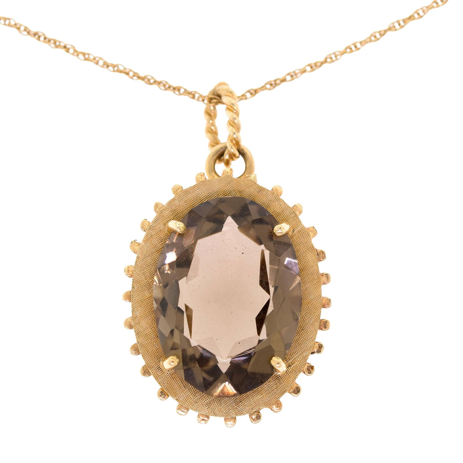 VINTAGE 14K GOLD SMOKY QUARTZ PENDANT & CHAIN.: A vintage, 14k yellow gold (stamped) pendant, 1 1/4 inches long, set with an approx. 18 ct., faceted oval, medium brown, smoky quartz and 14k yellow gold (stamped), lightweight rope chain, 15 inches l