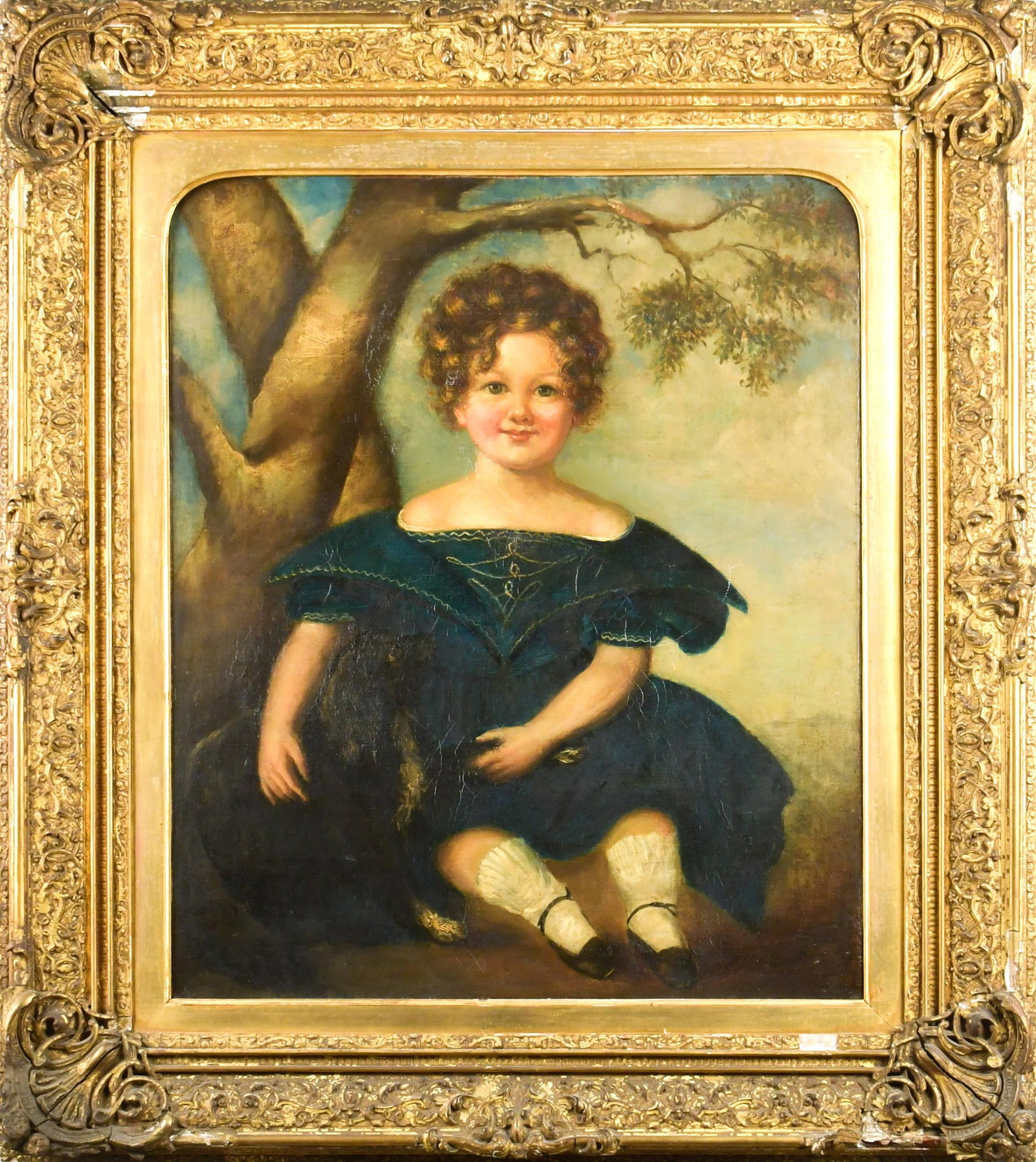 19TH C. OIL, PORTRAIT OF CHILD IN BLUE DRESS WITH DOG: A mid-19th C. oil on canvas, young child wearing a blue dress with a dog, sitting in a landscape, unsigned. In an ornate period frame with label on reverse. Image 24” x 20”, Frame 33.5R