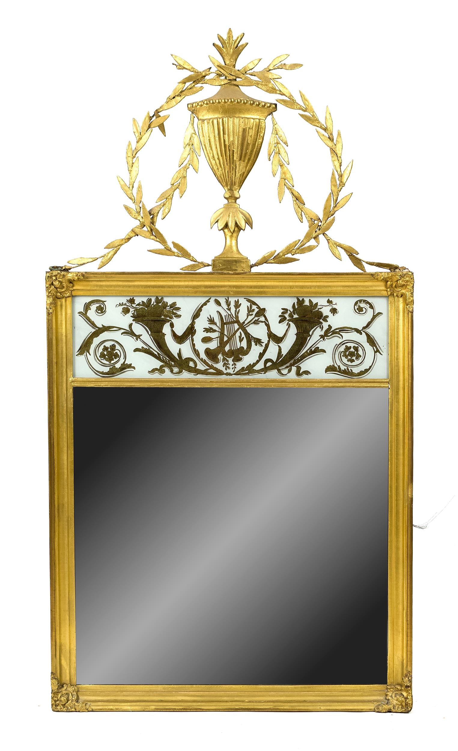 FEDERAL GILT EGLOMISE MIRROR, CA. 1810.: A ca. 1810 Federal gilt mirror with an eglomise panel of musical notes and cornucopia, topped with a delicate wreath and urn. 44”H x 23”W.