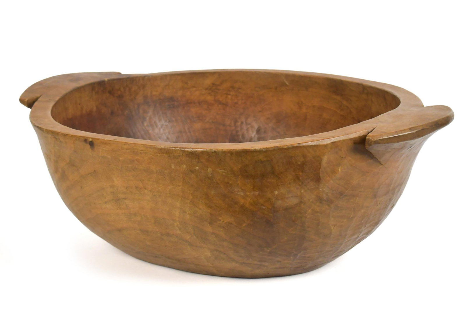 ANTIQUE CARVED WOODEN TRENCHER.: A large antique carved wood trencher with handles. 10”H x 27”W.