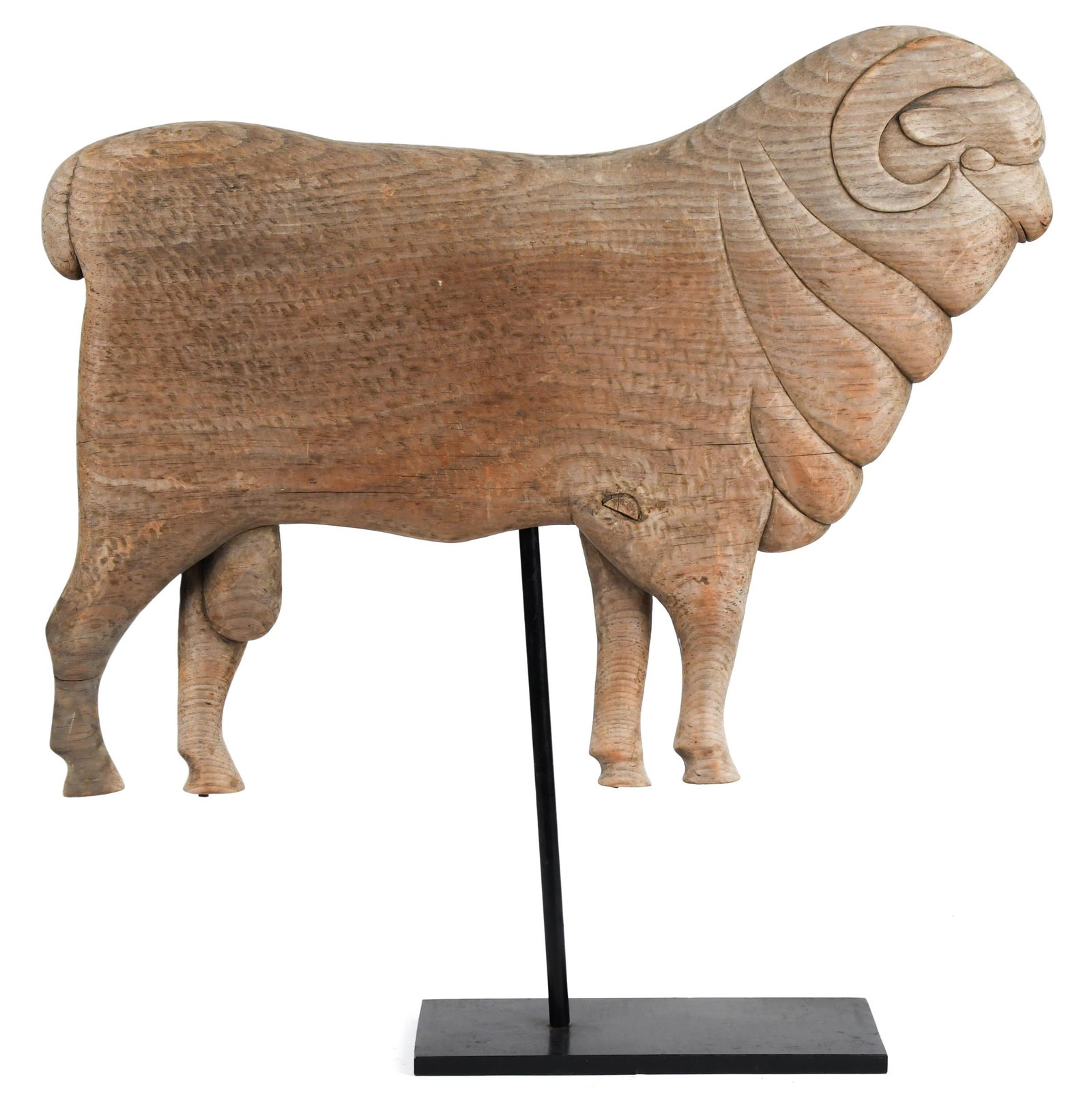 VINTAGE CARVED WOOD MERINO RAM.: An early 20th C. well-carved pine wood Merino ram on a custom iron stand. 18”H x 24”L. Provenance: Goodnow estate Darien, CT.