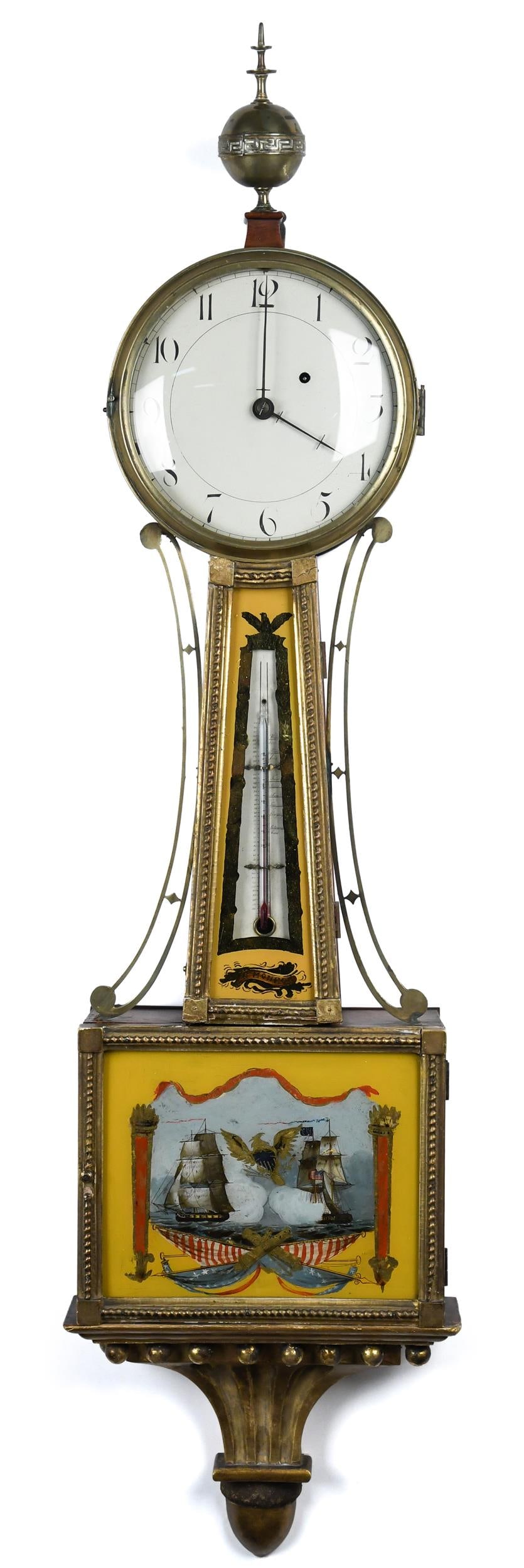 RARE MONROE MA BANJO CLOCK.: A fine ca. 1825 Massachusetts banjo clock, with a rare thermometer throat panel signed 'M. Monroe', the lower reverse painted tablet depicting the battle between the Constitution and the Gurriere, ove