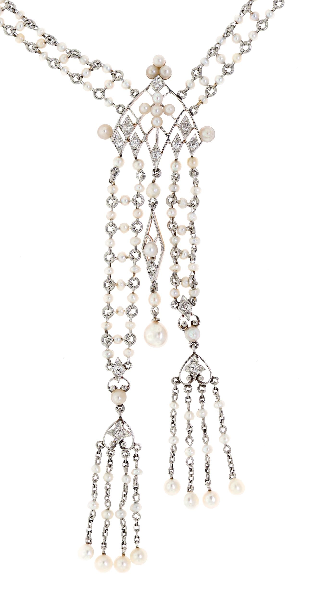 EDWARDIAN PLATINUM PEARL & DIAMOND SAUTOIR NECKLACE.: An antique, Edwardian, platinum (tested) and 18k yellow gold (tested, on reverse), seed pearl, sautoir necklace set with approx. .33 ct. tw., Old European cut, natural diamonds of G-H color and VS-SI 