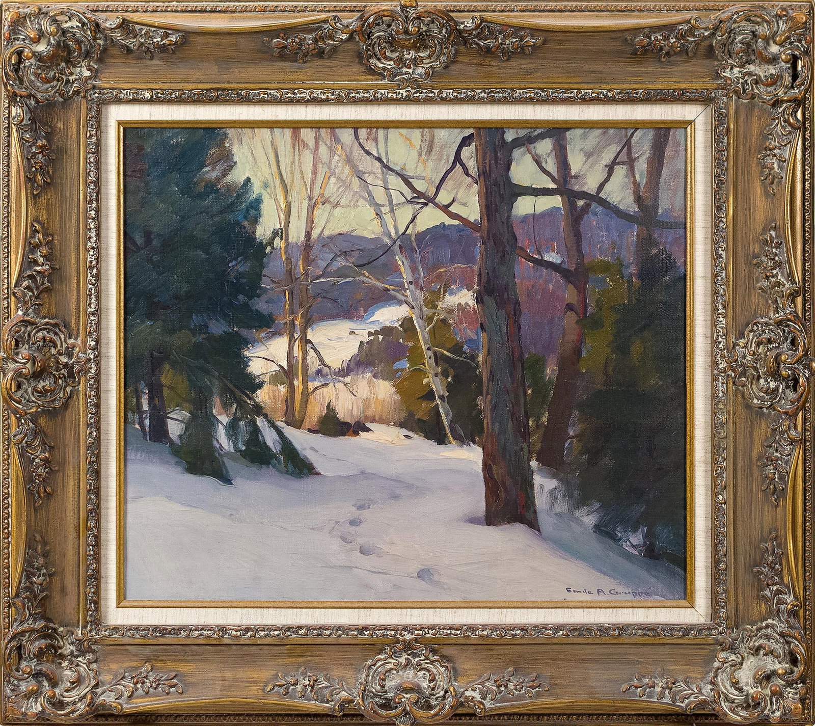 EMILE GRUPPE OIL, WINTER LANDSCAPE.: An Emile Gruppe (1896-1978) oil on canvas, a forested winter landscape, signed lower right, Emile A. Gruppe. Image 19.5” x 23.5”, Frame 30” x 34”.