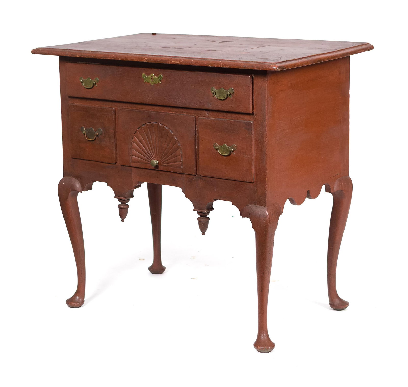 18TH C. MA QUEEN ANNE RED PAINTED DRESSING TABLE.: A good ca. 1750 New England Queen Anne red-painted cherry lowboy with an overhung thumbnail molded top, case with four drawers including central fan carved drawer, over shaped aprons with drop turned 
