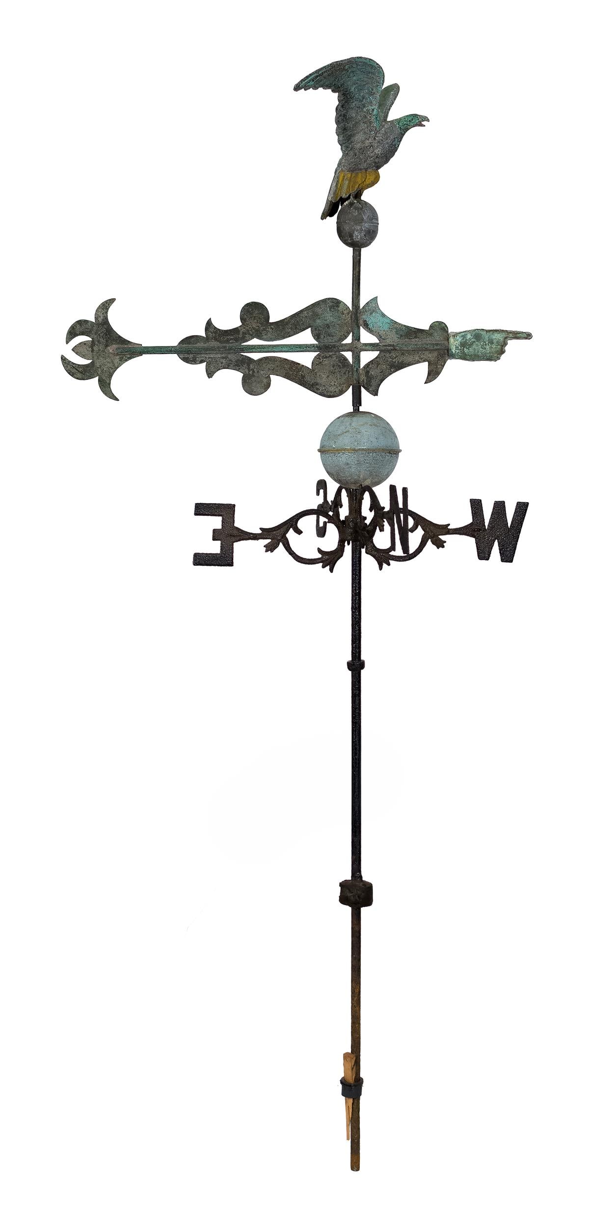 19TH C. EAGLE WEATHERVANE WITH BANNER DIRECTIONAL.: A unique 19th C. copper spread wing eagle weathervane with an unusual banner form direction with three-dimensional copper pointing hand, mounted on iron rod with black painted directional markers. Van