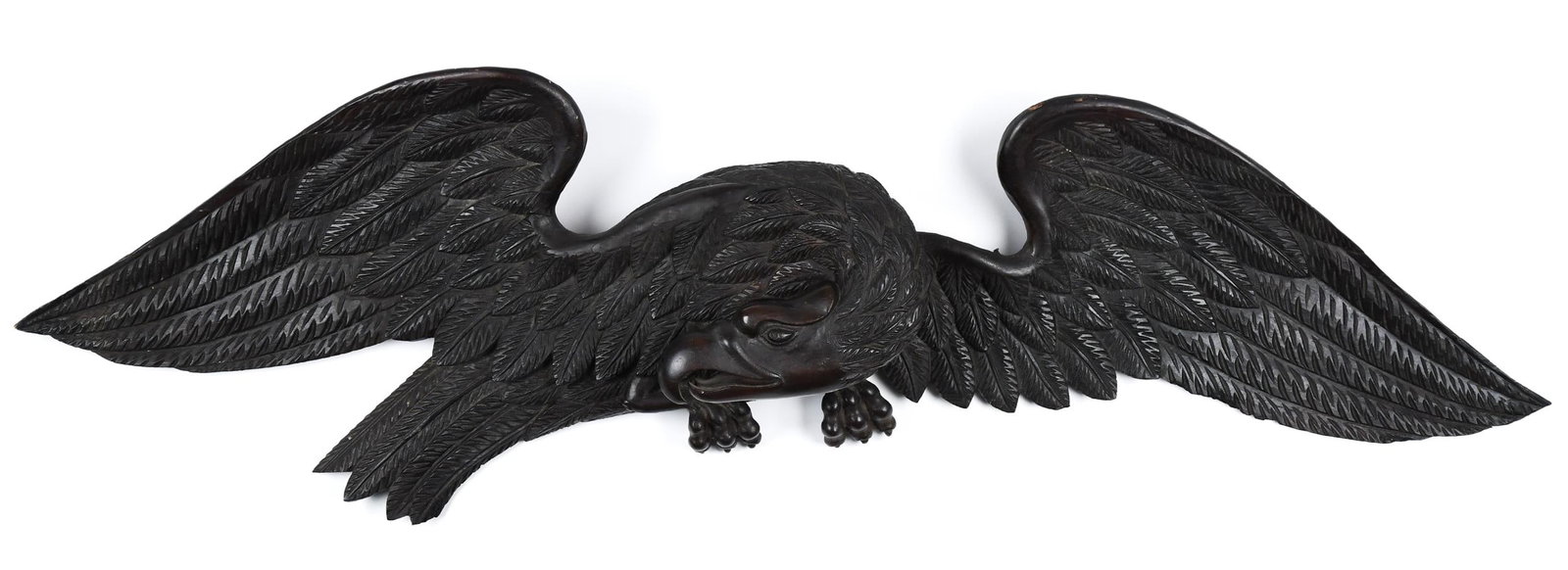 CARVED 19TH C. SPREAD WING EAGLE.: A dark stained antique carved wooden spread wing eagle with Bellamy mannerisms. 13”H x 41”W.