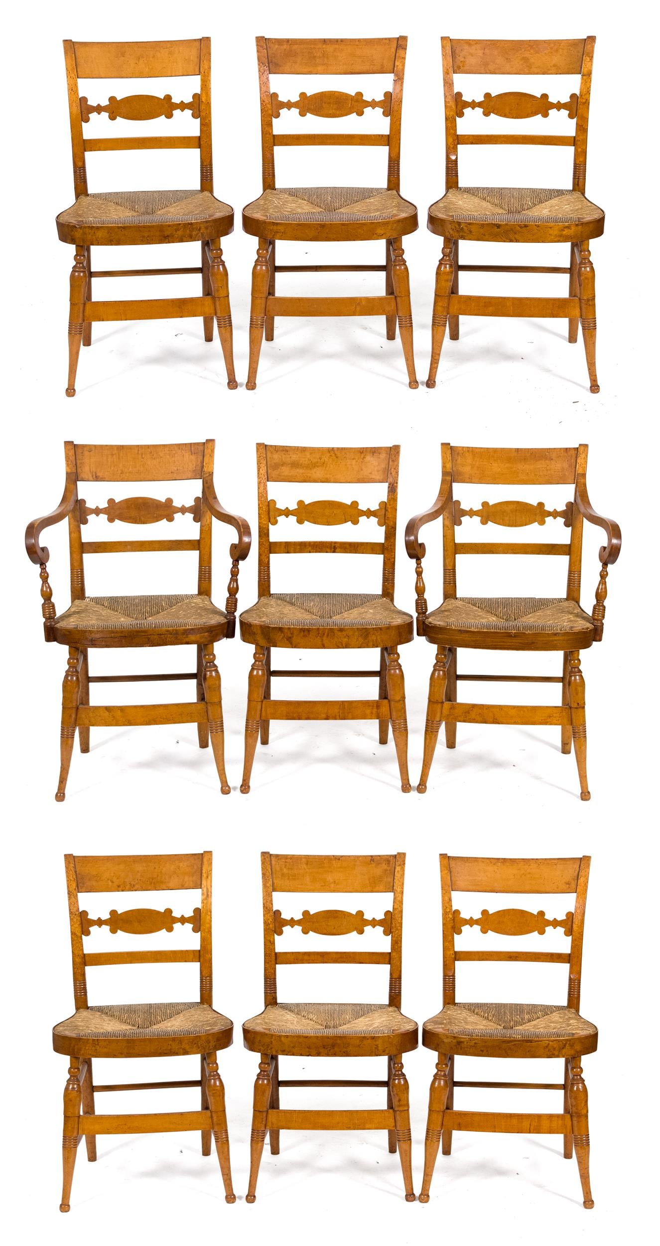 19TH C. AMERICAN BIRDSEYE MAPLE DINING CHAIRS, 9PCS.: A rare set of nine ca. 1840 American birdseye maple dining chairs with rush seats. Set includes two arm chairs and seven sides.Armchairs 33.5”H x 21”W x 18”D x 17.5” seat H.Sid