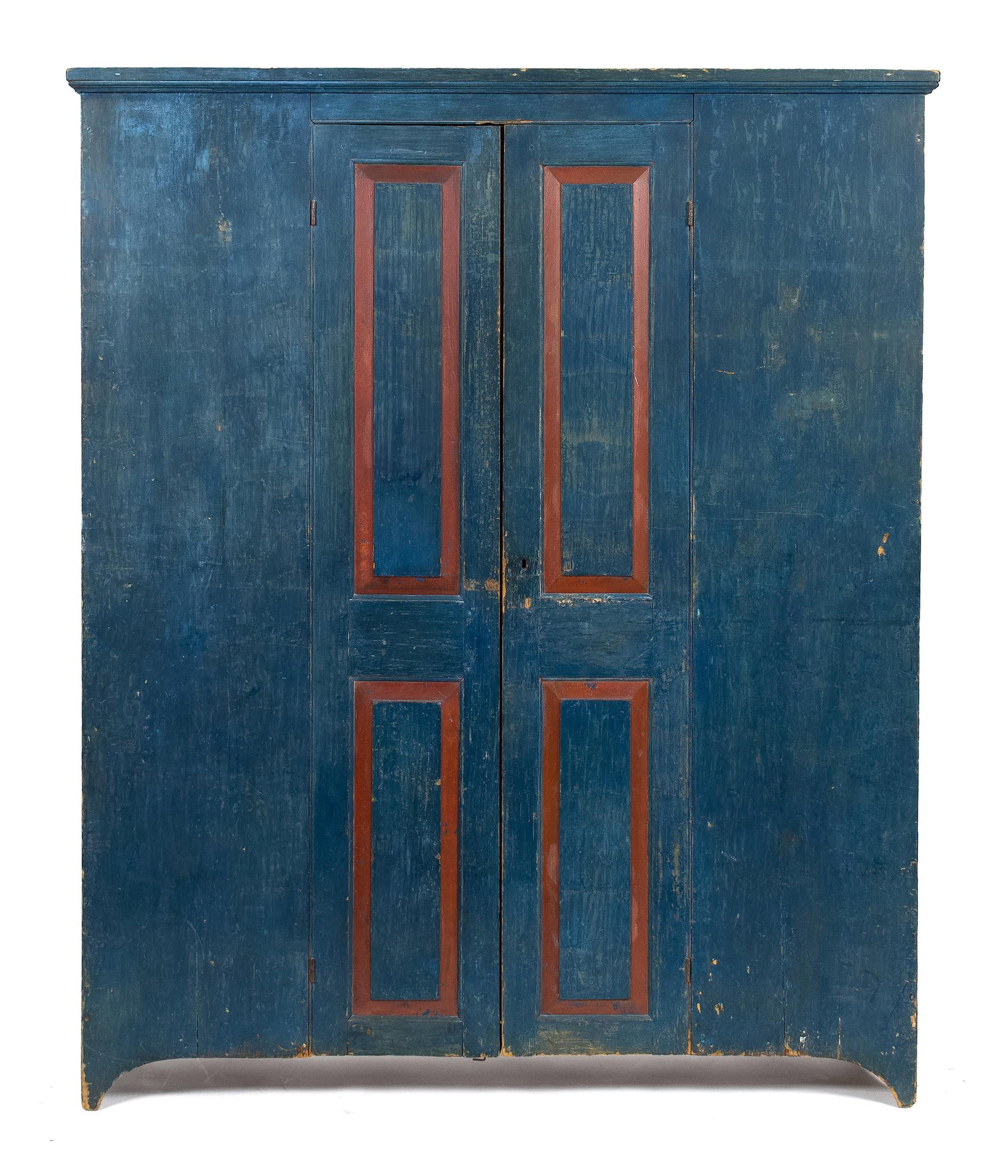 18TH C. AMERICAN BLUE PAINTED PRESS CUPBOARD.: An 18th C. NH/Maine White Mountain area single part floor cupboard in old blue paint with red details. Two centrally oriented blind paneled doors open to reveal original interior with adjustable shelv