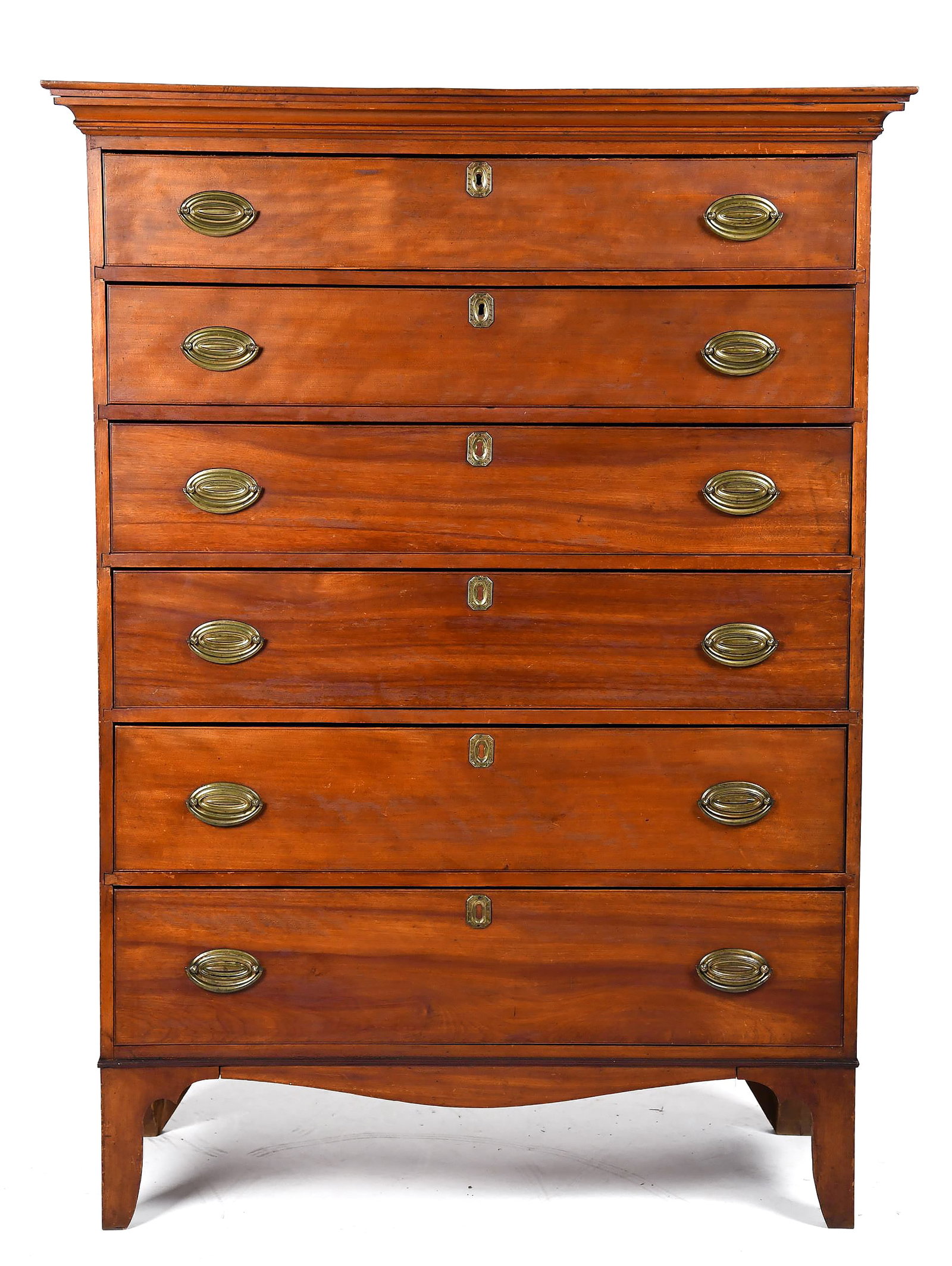 EARLY 19TH C. NEW ENGLAND SIX DRAWER TALL CHEST.: A ca. 1800 New England birch and pine secondary tall chest with a molded top over six graduated drawers, all set with period brass. Chest retains good old color/finish and original presence. 56.75R