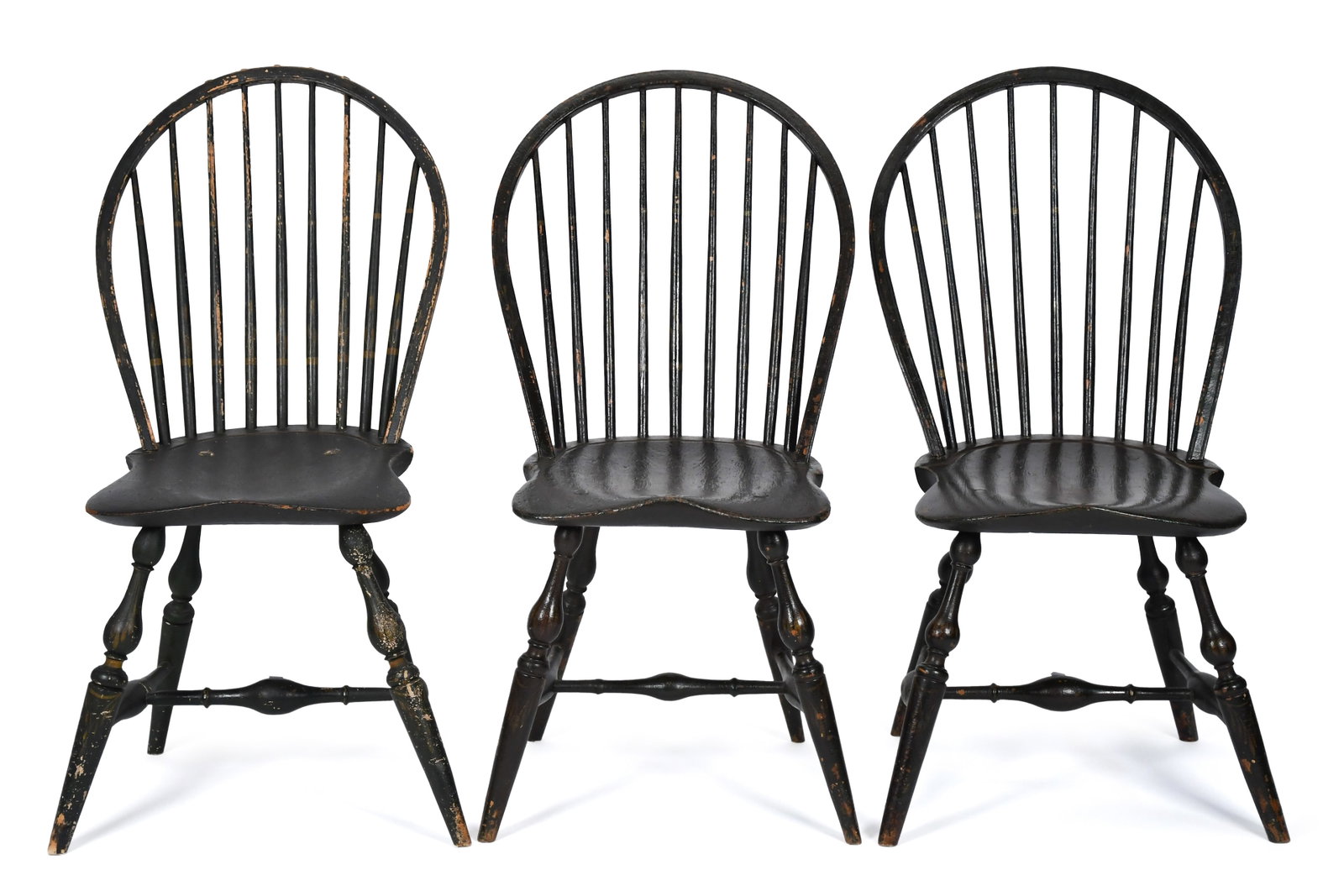 THREE 18TH C. WINDSOR CHAIRS IN PAINT.: A set of three 18th C. American bow-back Windsor side chairs with nine-spindle backs, saddle formed seats, stretchered bases with vase & ring turned legs. All three chairs in distressed and worn antiq