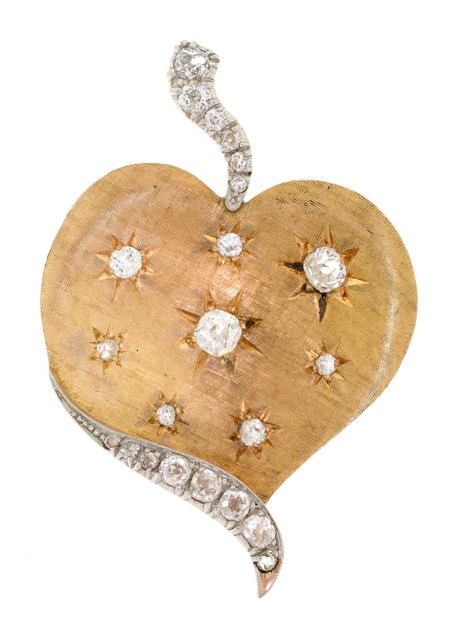 VINTAGE GOLD OLD MINE & EUROPEAN CUT DIAM. HEART PIN.: A vintage, 10k-14k yellow gold and platinum (tested), heart shaped pin set with approx. 1.55 ct. tw., Old Mine, Old European and single cut, natural diamonds of G-H-I color and VS-I clarity, 2 1/4 inc