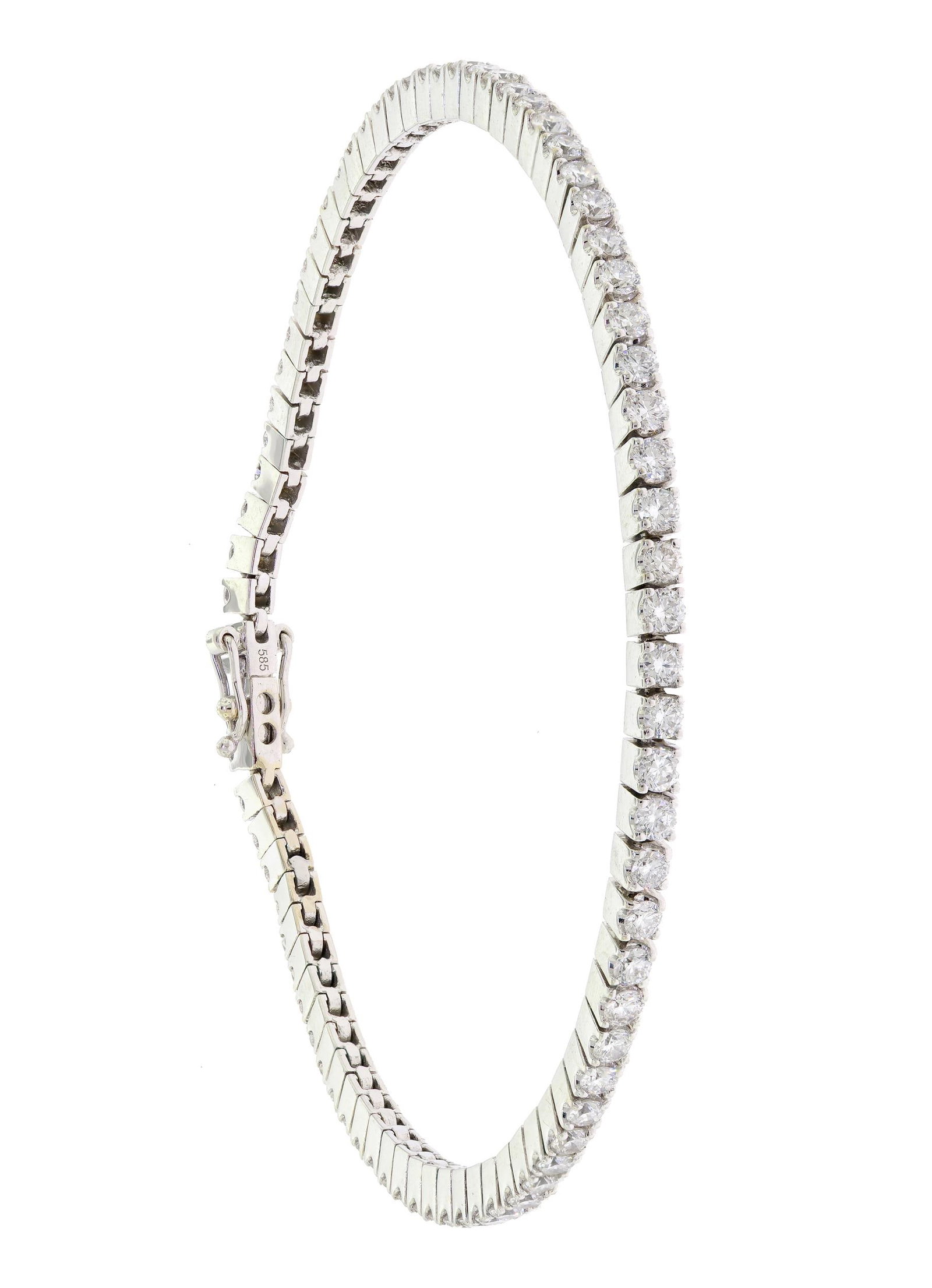 14K WHITE GOLD 2 CT. TW. DIAMOND TENNIS BRACELET.: A 14k white gold (stamped) tennis bracelet set with approx. 2.28 ct. tw., round brilliant cut, natural diamonds or G-H color and VS-SI clarity, 7 1/8 inches long, 9.8 grams. Tested as natural mined