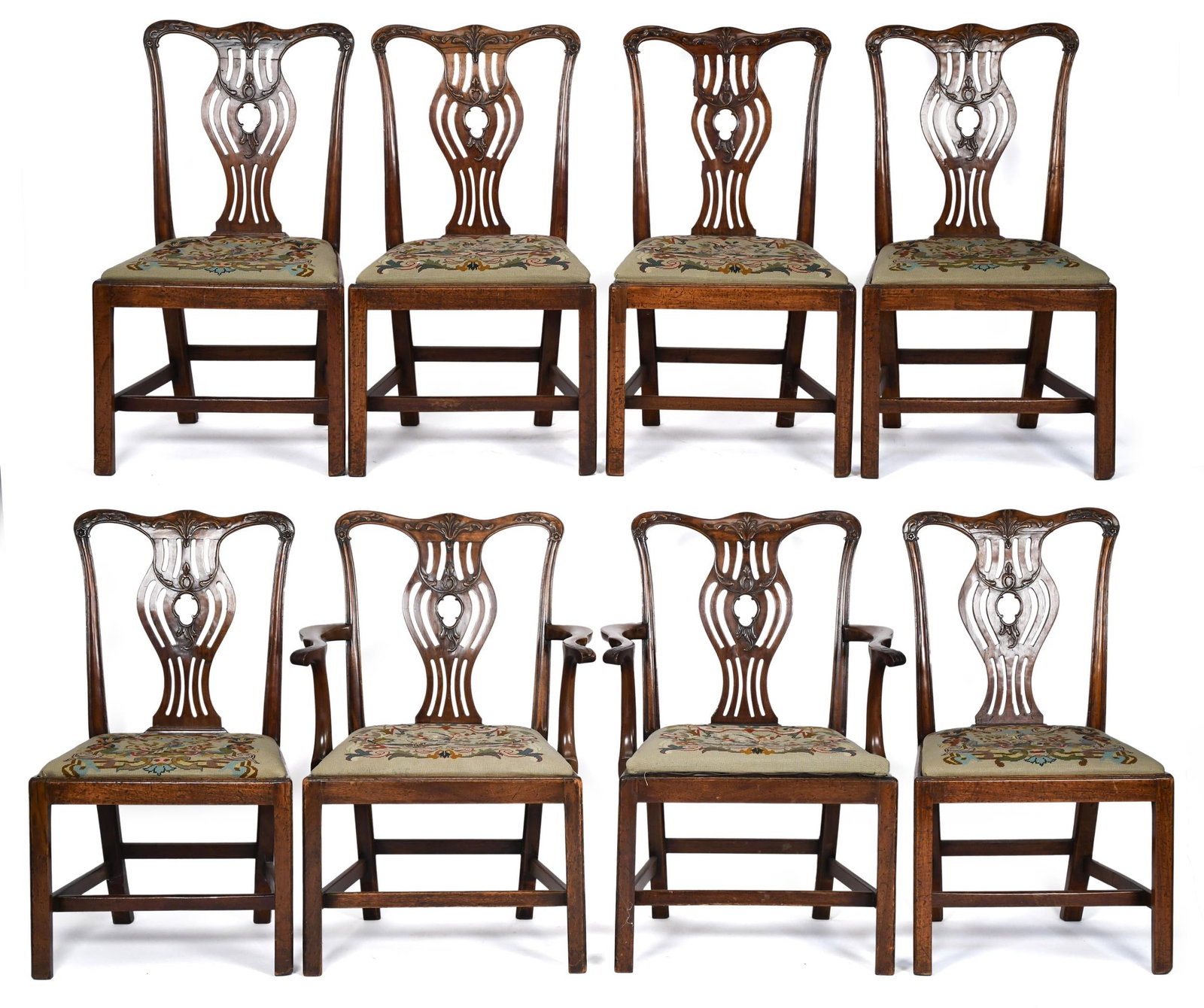 18TH/19TH C. CHIPPENDALE MAHOGANY DINING CHAIRS.: A set of eight Chippendale carved mahogany dining chairs with vintage needlepoint seats. Six 18th C. side-chairs and two 19th C. armchairs made to match. Armchairs 37”H x 25.5”W x