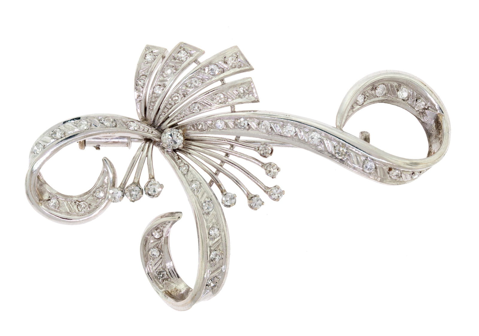VINTAGE SWIRLY PLATINUM & DIAMOND BROOCH.: A vintage, platinum (tested), swirly pin set with approx. 1.10 ct. tw., single and Old European cut diamonds of H-I color and VS-I clarity, 2 3/8 inches long, 11.0 grams.