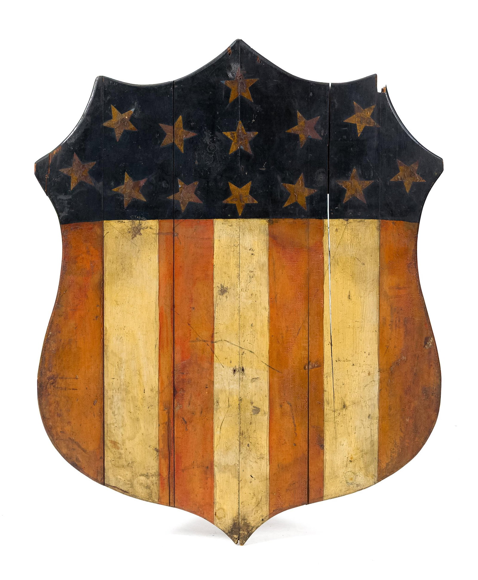 19TH C. PAINTED WOODEN PATRIOTIC SHIELD.: A 19th C. painted wood wall hanging shield, with red, white and blue patriotic motifs. 32.5” x 26”.