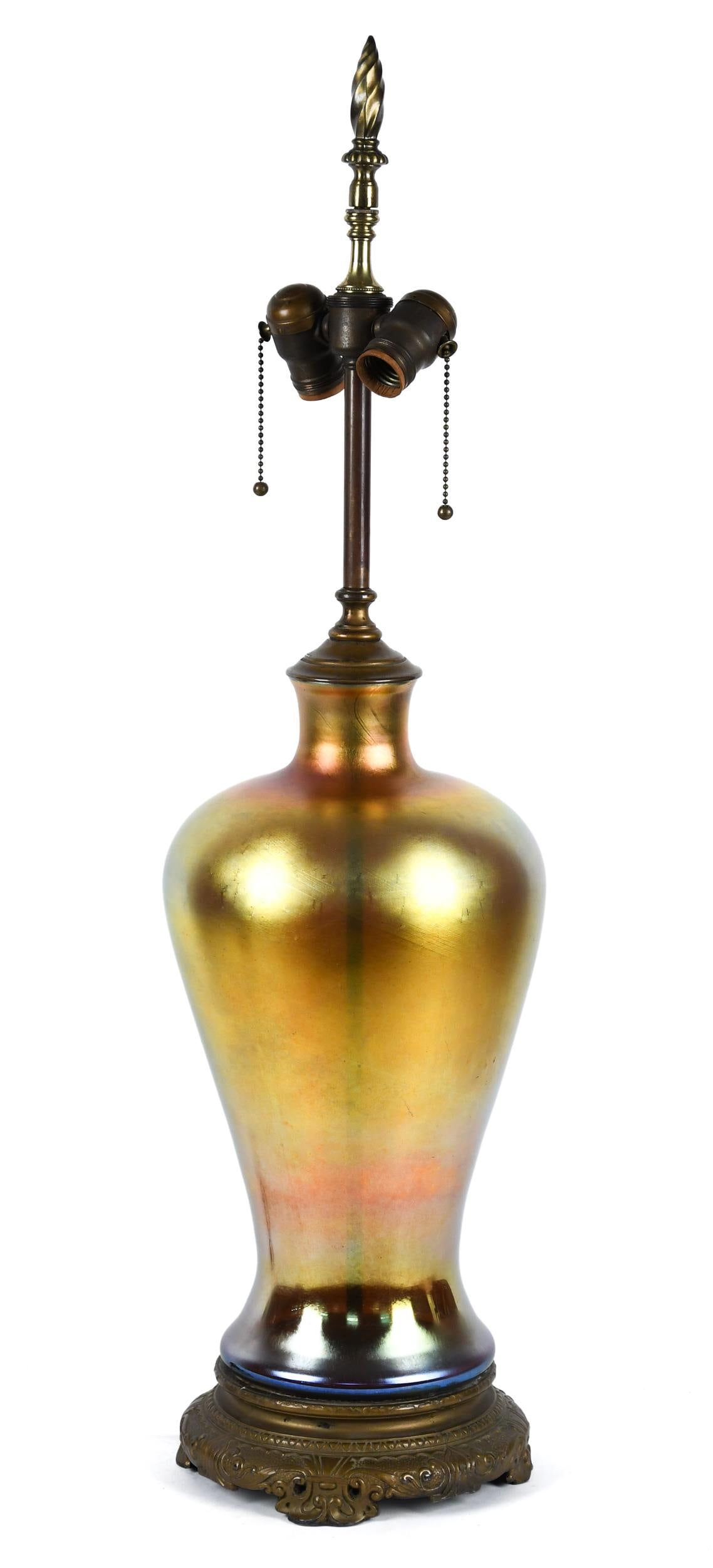 ART GLASS VASE ATTRIBUTED STEUBEN, MOUNTED AS LAMP.: An early 20th C. baluster form favrile or aurene art glass vase which has been converted to a table lamp with excellent cast bronze base. Vase 16”H, Overall 32”H.