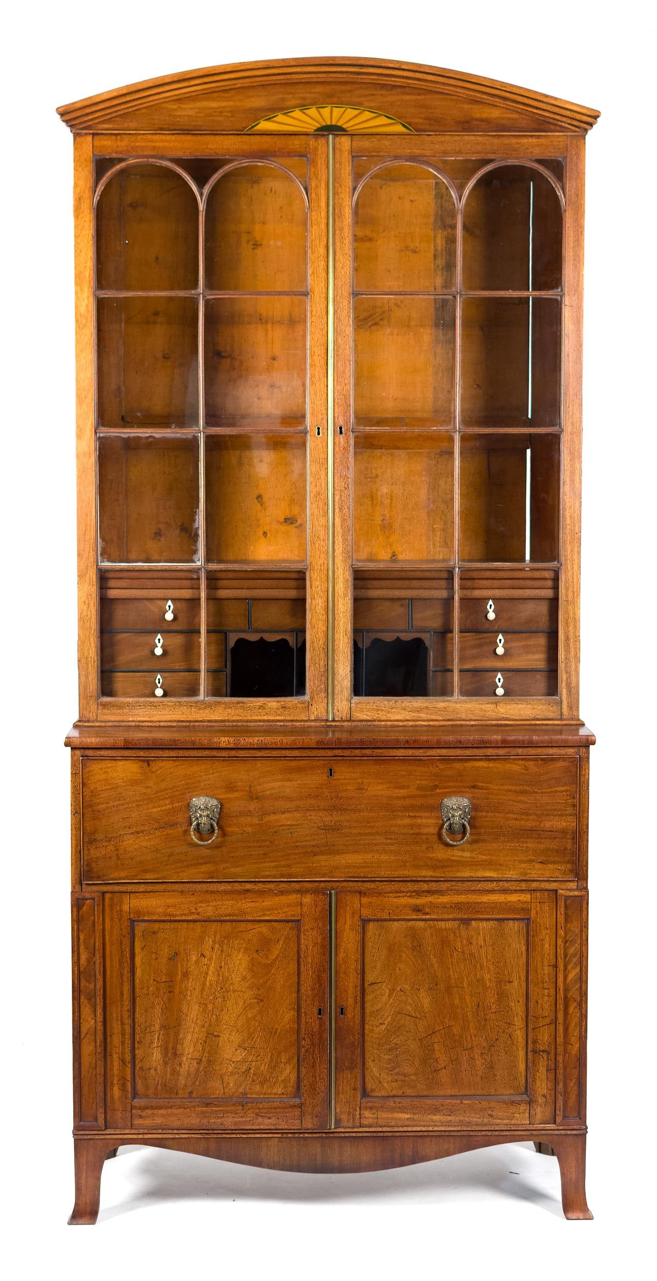 19TH C. ENGLISH GEORGIAN BUTLER SECRETARY.: A ca. 1820 English Georgian two-part mahogany secretary bookcase. Upper bookcase section with an applied arched and satinwood inlaid cornice over two eight light arched doors and interior drawers.