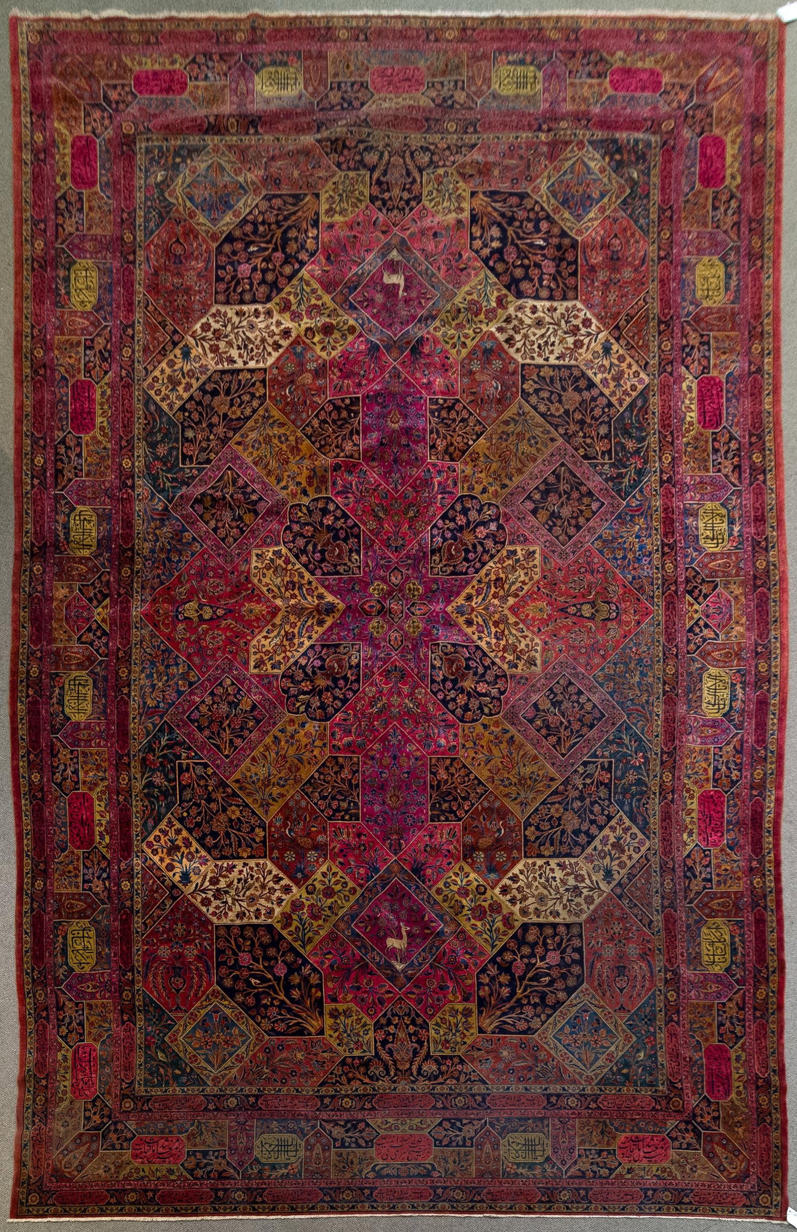 ANTIQUE SIGNED SAROUK ORIENTAL ROOM SIZE RUG.: A good large size hand woven antique Sarouk Oriental signed room size rug with animal and naturalistic motifs in ‘windowed’ design. 11’9” x 18'2”.